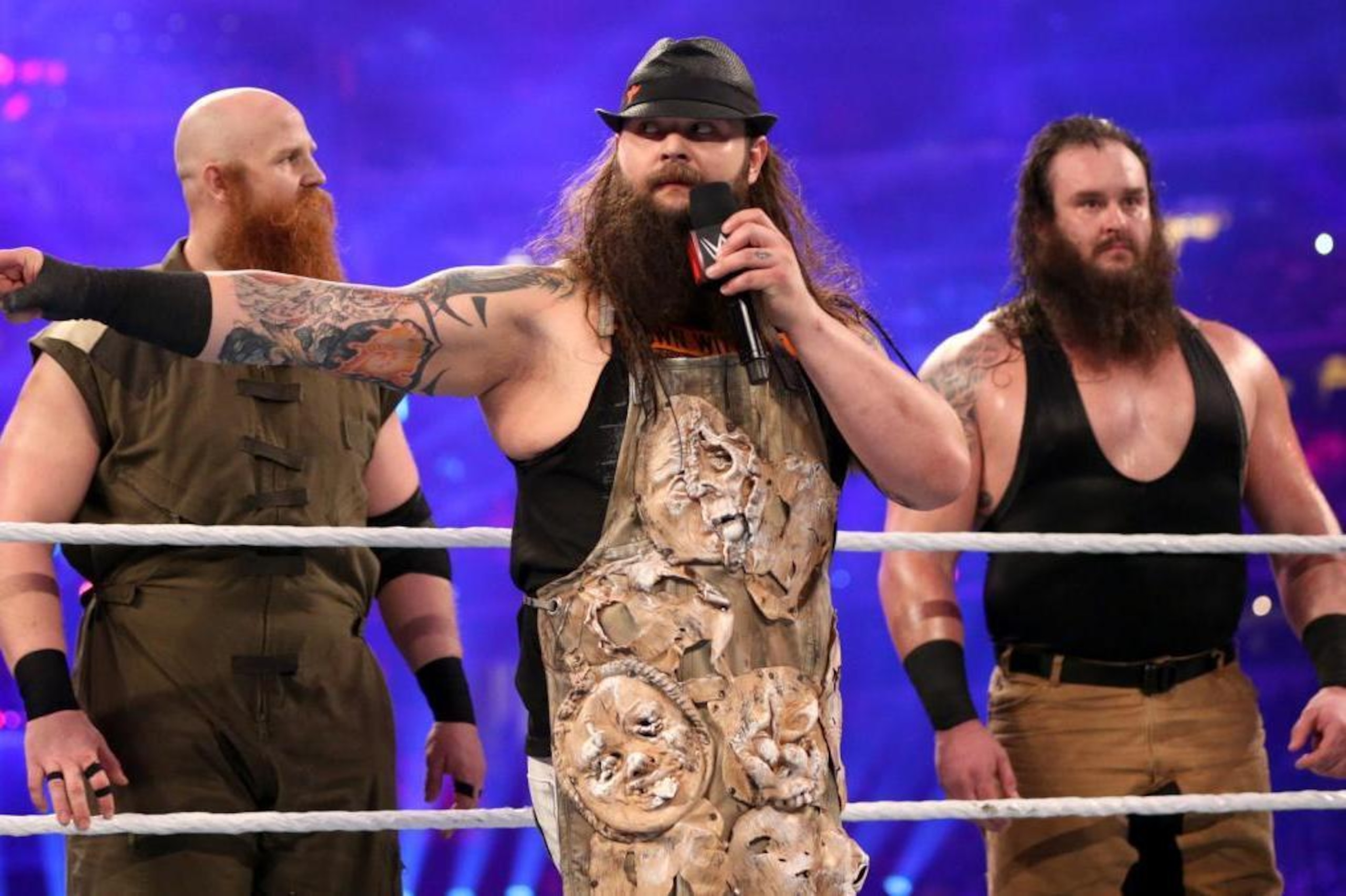 Erick Rowan and Braun Strowman stand guard behind Bray Wyatt.