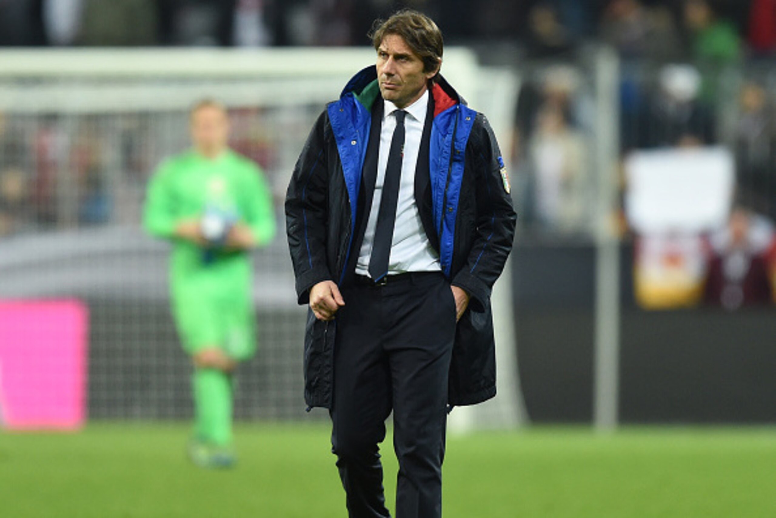 Italian headcoach Antonio Conte walks at the field after a friendly football match Germany vs Italy in Muinch, southern Germany, on March 29, 2016.  / AFP / CHRISTOF STACHE        (Photo credit should read CHRISTOF STACHE/AFP/Getty Images)