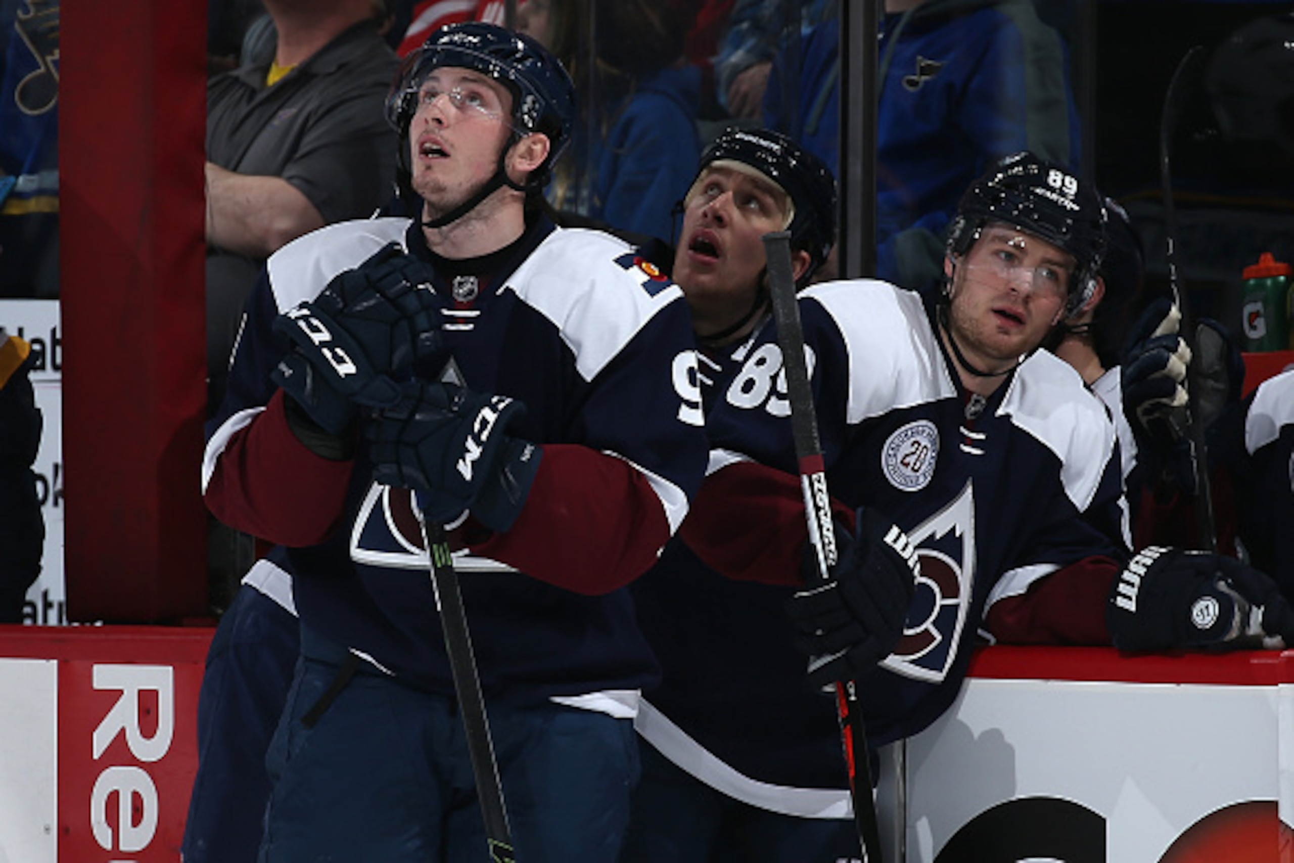 DENVER, COLORADO - APRIL 03:  Matt Duchene #9, Shawn Matthias #18 and Mikkel Boedker #89 of the Colorado Avalanche look on as the St. Louis Blues celebrate a goal by Colton Parayko #55 of the St. Louis Blues to take a 3-0 lead in the first period at Pepsi