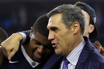 HOUSTON, TEXAS - APRIL 04:  Kris Jenkins #2 of the Villanova Wildcats celebrates with head coach Jay Wright after defeating the North Carolina Tar Heels 77-74 to win the 2016 NCAA Men's Final Four National Championship game at NRG Stadium on April 4, 2016