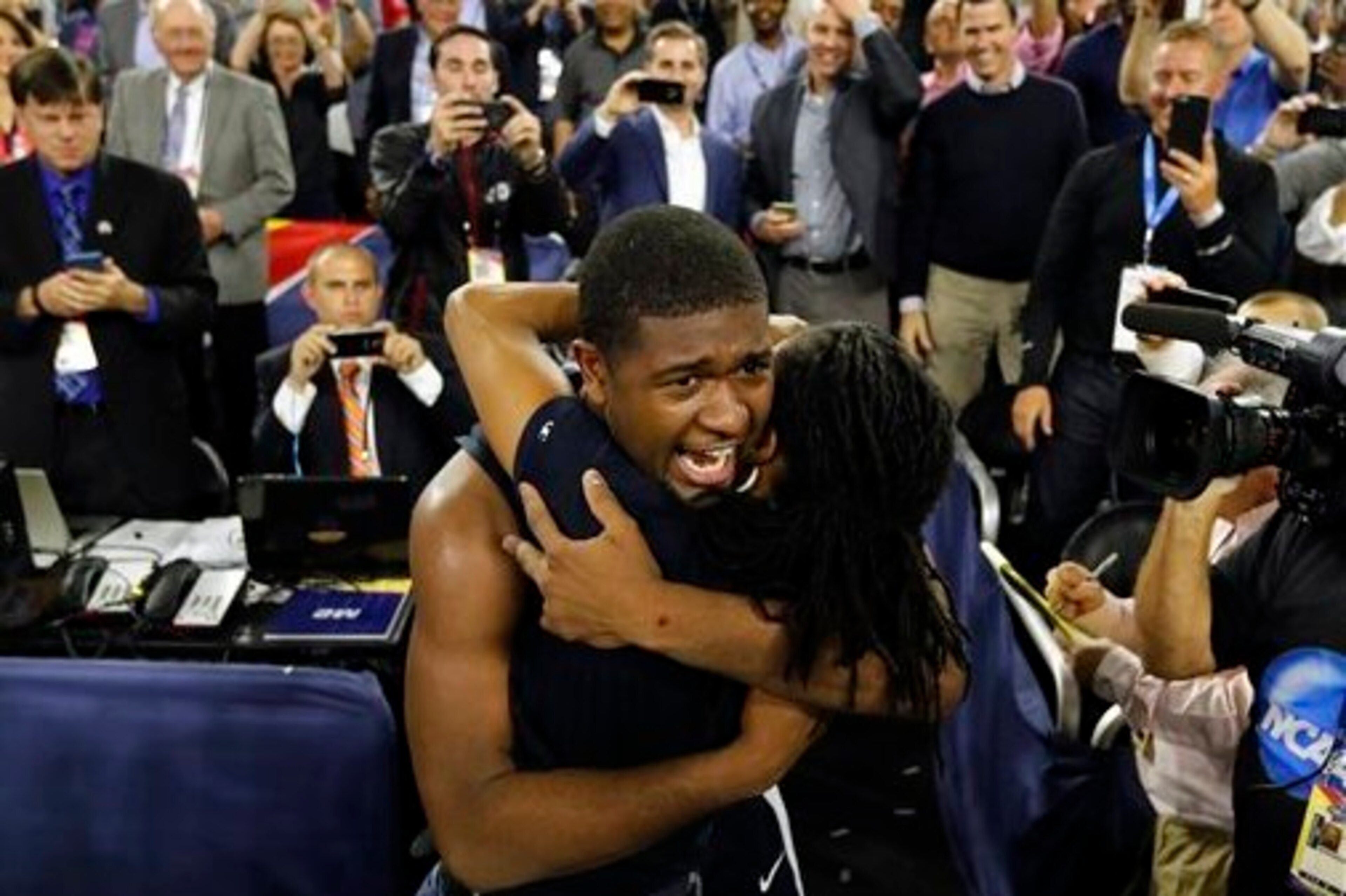 Kris Jenkins shares a hug with his mother, Felicia, after Villanova's 77-74 win in the national title game.