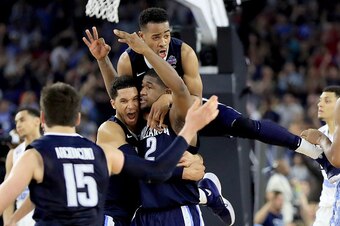 HOUSTON, TEXAS - APRIL 04:  Kris Jenkins #2 of the Villanova Wildcats celebrates with teammates after making the game-winning three pointer to defeat the North Carolina Tar Heels 77-74 in the 2016 NCAA Men's Final Four National Championship game at NRG St