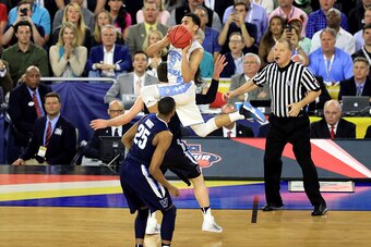 HOUSTON, TEXAS - APRIL 04:  Marcus Paige #5 of the North Carolina Tar Heels shoots a three-pointer to tie the game with 4.7 seconds left in the second half against the Villanova Wildcats during the 2016 NCAA Men's Final Four National Championship game at 