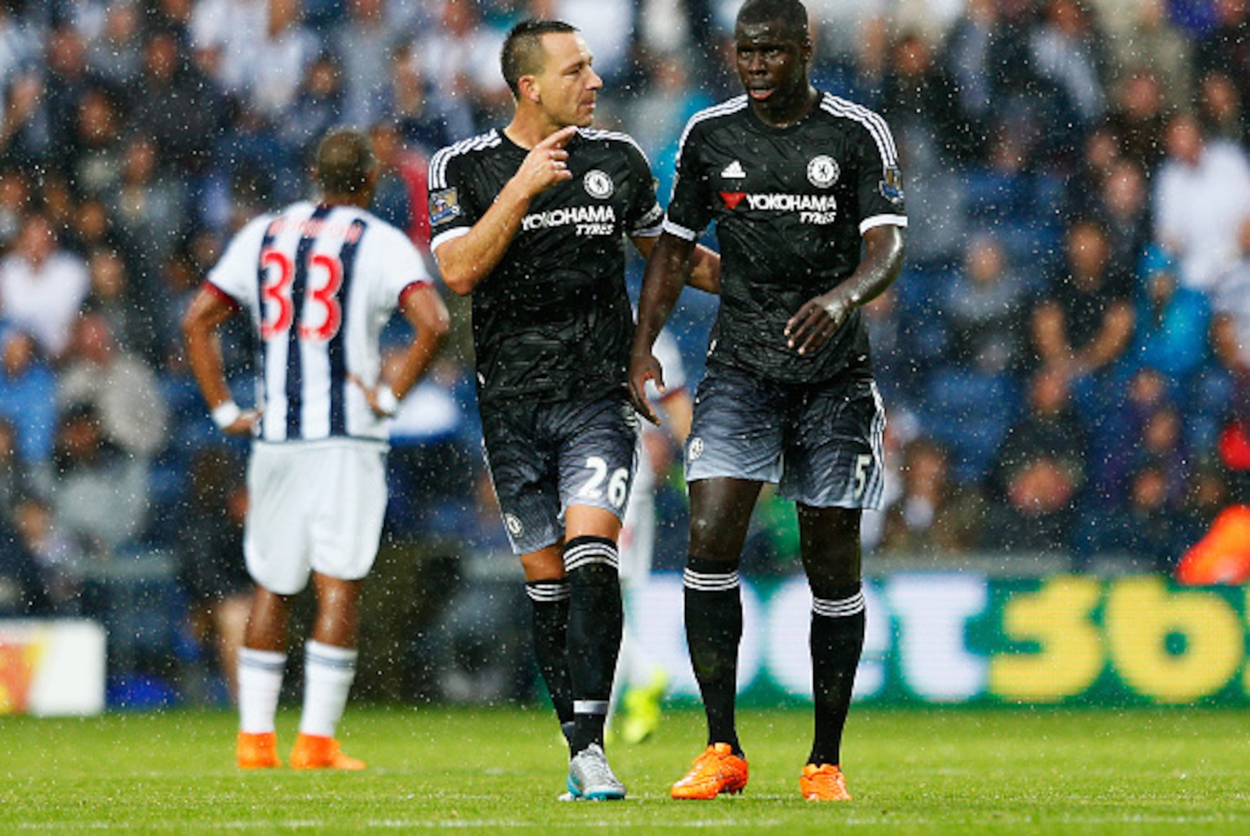 WEST BROMWICH, ENGLAND - AUGUST 23:  John Terry of Chelsea talks to Kurt Zouma of Chelsea during the Barclays Premier League match between West Bromwich Albion and Chelsea at The Hawthorns on August 23, 2015 in West Bromwich, England.  (Photo by Julian Fi