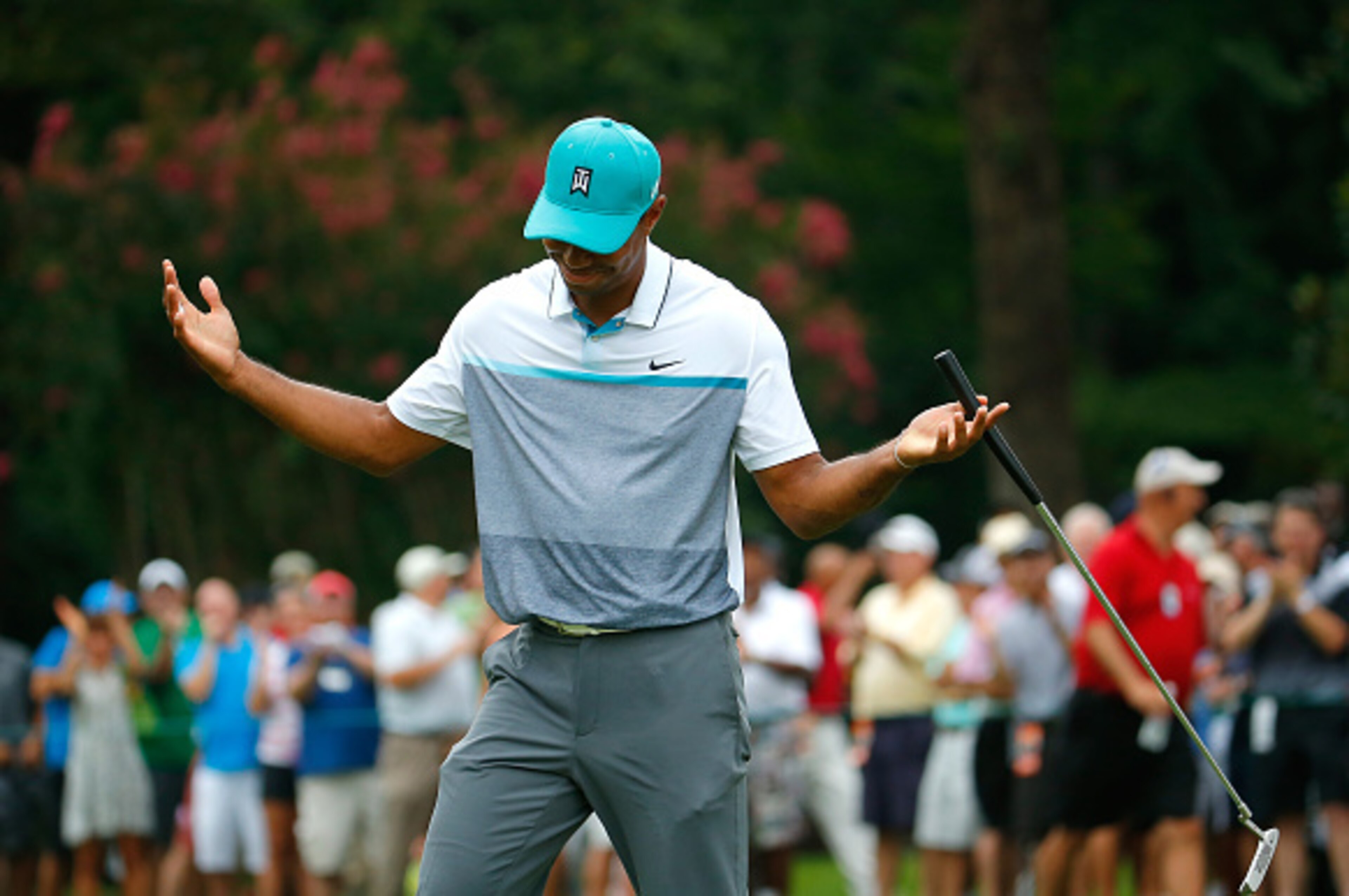 GREENSBORO, NC - AUGUST 20:  Tiger Woods reacts after sinking a birdie putt on the 13th green during the first round of the Wyndham Championship at Sedgefield Country Club on August 20, 2015 in Greensboro, North Carolina.  (Photo by Kevin C. Cox/Getty Ima