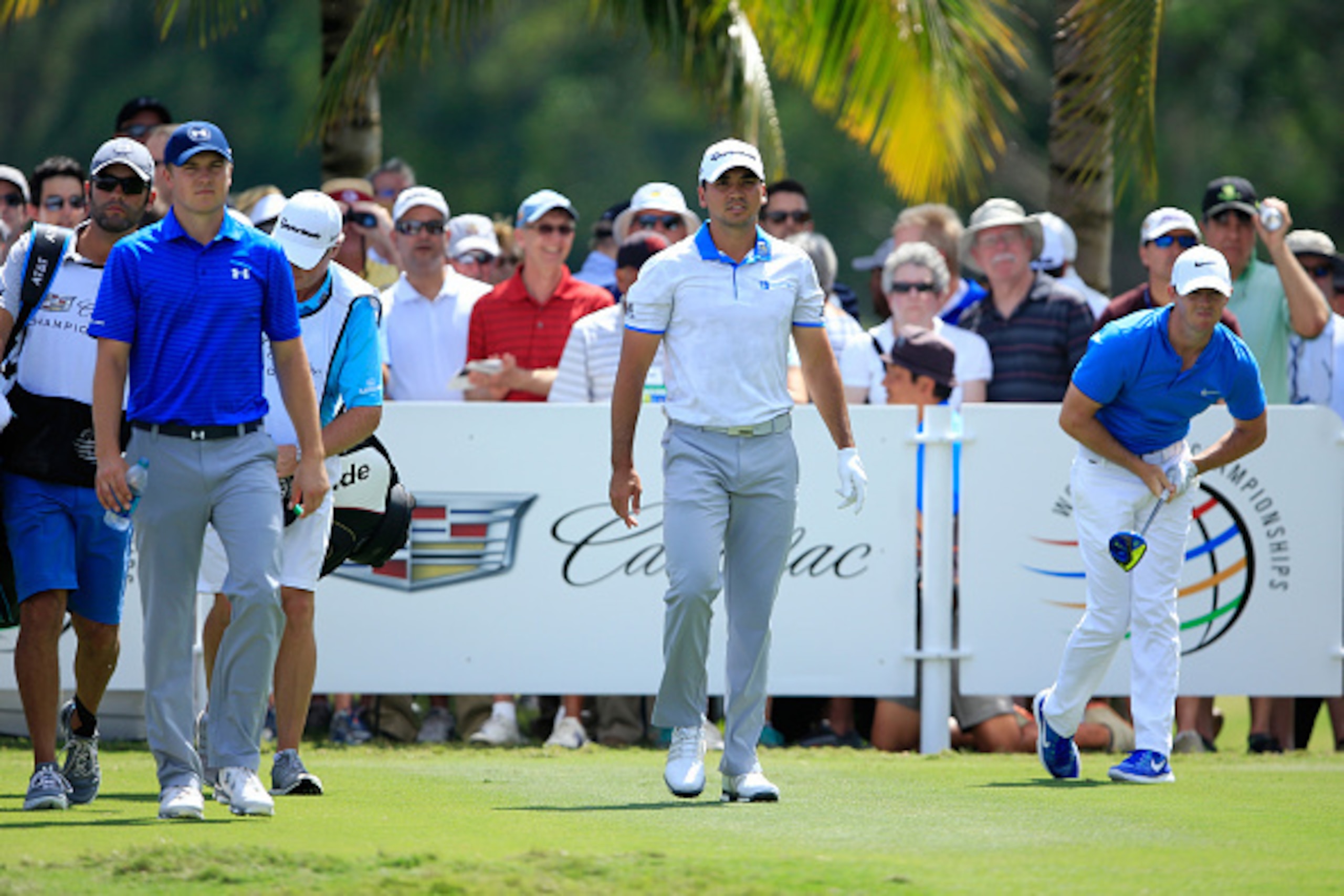 DORAL, FL - MARCH 04:  Jordan Spieth, Jason Day of Australia and Rory McIlroy of Northern Ireland after teeing off on the second hole during the second round of the World Golf Championships-Cadillac Championship at Trump National Doral Blue Monster Course
