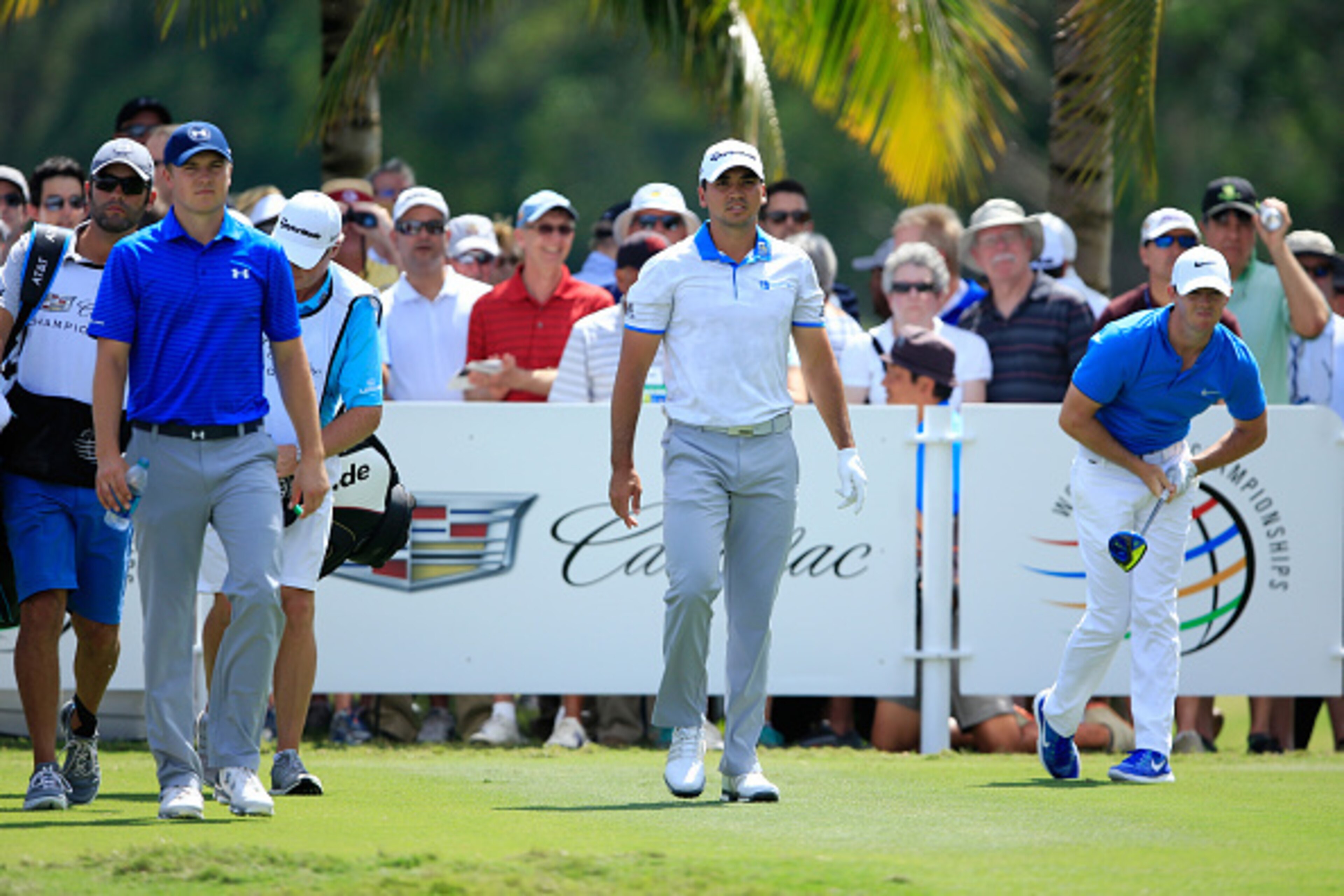 DORAL, FL - MARCH 04:  Jordan Spieth, Jason Day of Australia and Rory McIlroy of Northern Ireland after teeing off on the second hole during the second round of the World Golf Championships-Cadillac Championship at Trump National Doral Blue Monster Course