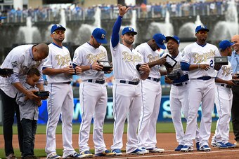 KANSAS CITY, MO - APRIL 5:  Mike Moustakas #8 of the Kansas City Royals waves to the crowd after he and members of his team received their World Series  Championship ring during a ceremony prior to a game against the New York Mets at Kauffman Stadium on A