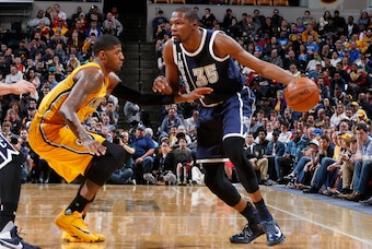 Mar 19, 2016; Indianapolis, IN, USA; Oklahoma City Thunder forward Kevin Durant (35) is guarded by Indiana Pacers forward Paul George (13) at Bankers Life Fieldhouse. Oklahoma City defeats Indiana 115-111. Mandatory Credit: Brian Spurlock-USA TODAY Sports