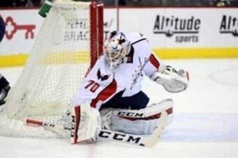 Apr 1, 2016; Denver, CO, USA; Washington Capitals goalie Braden Holtby (70) defends his net in the second period against the Colorado Avalanche at the Pepsi Center. Mandatory Credit: Ron Chenoy-USA TODAY Sports