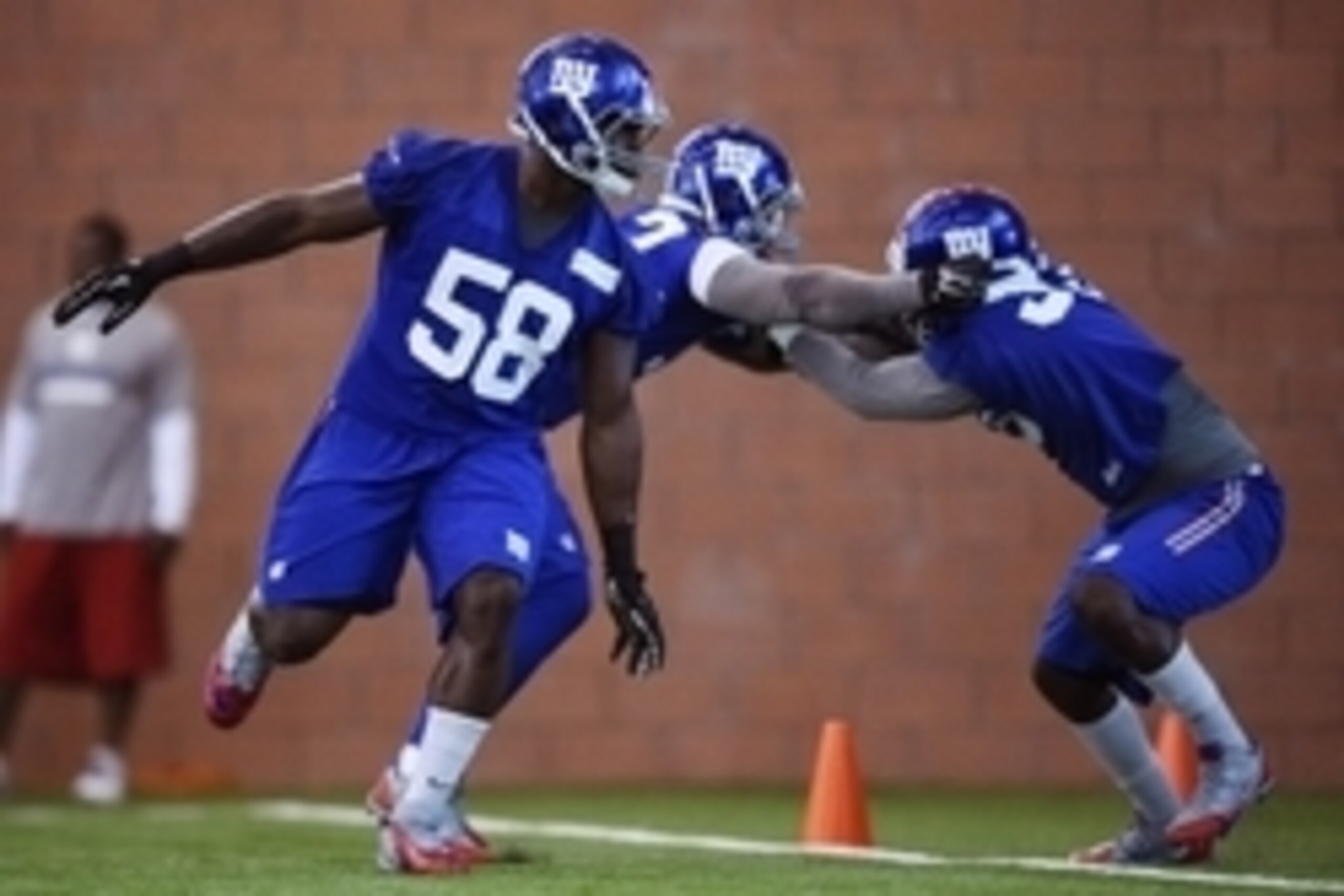 Jun 16, 2015; East Rutherford, NJ, USA; New York Giants defensive end Owa Odighizuwa (58) takes part in practice during minicamp at Quest Diagnostics Training Center. Mandatory Credit: Steven Ryan-USA TODAY Sports