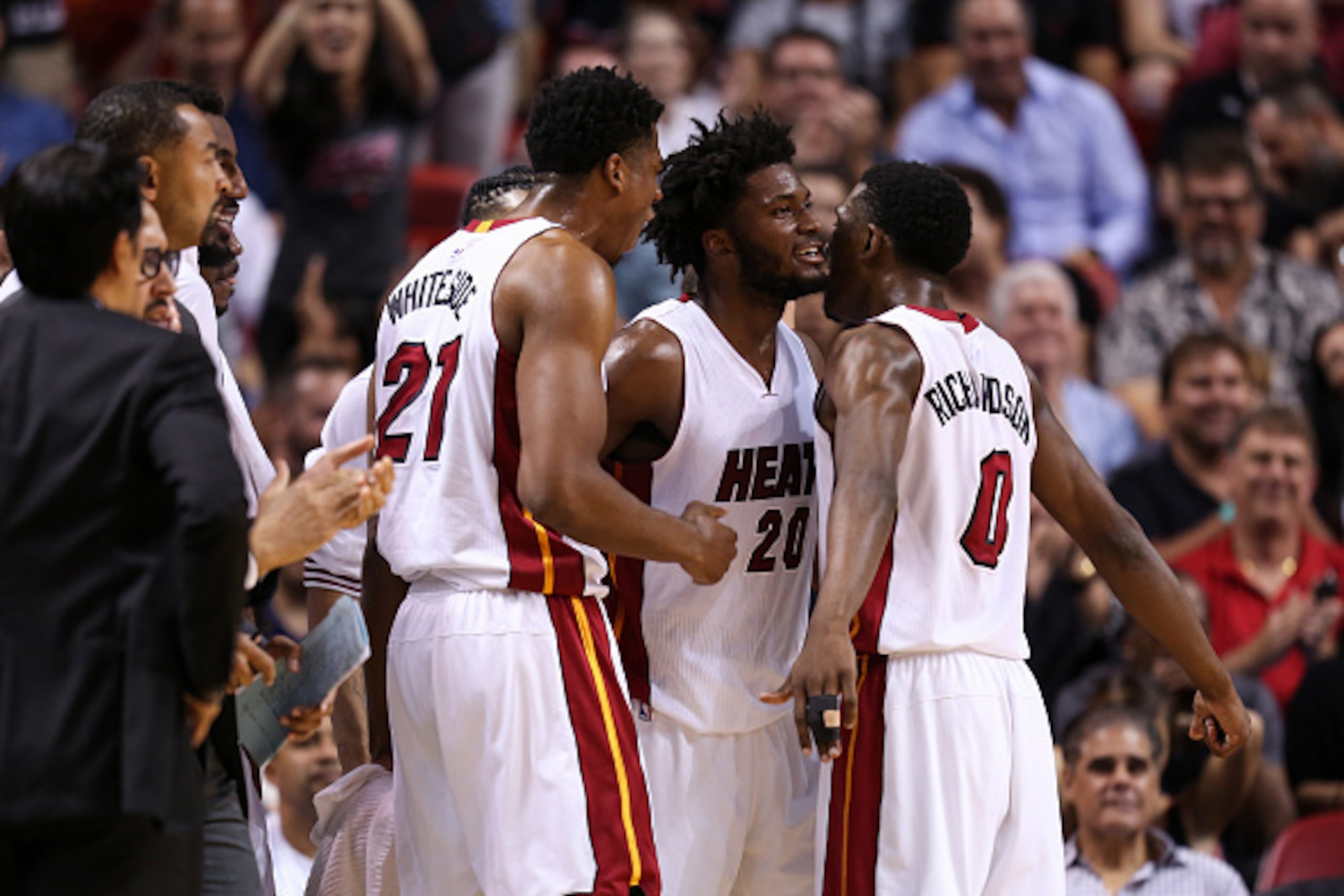 MIAMI, FLORIDA - APRIL 05: Justise Winslow #20 of the Miami Heat celebrates with teammates Hassan Whiteside #21 and Josh Richardson #0 during the game against the Detroit Pistons at the American Airlines Arena on April 5, 2016 in Miami, Florida. Miami def