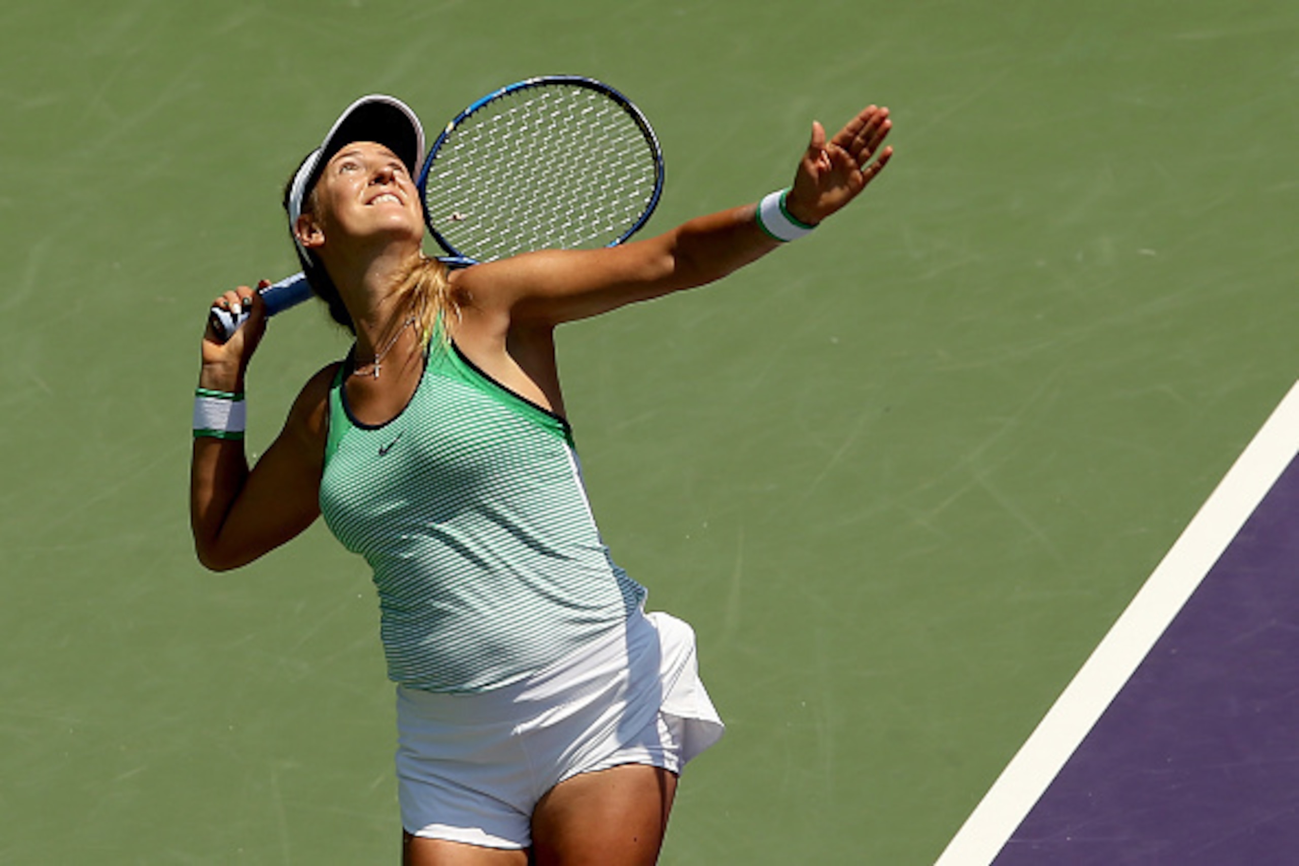 KEY BISCAYNE, FL - APRIL 02:  Victoria Azarenka of Belarus returns a shot to Svetlana Kuznetsova of Russia during the women's final on Day 13 of the Miami Open presented by Itau at Crandon Park Tennis Center on April 2, 2016 in Key Biscayne, Florida.  (Ph