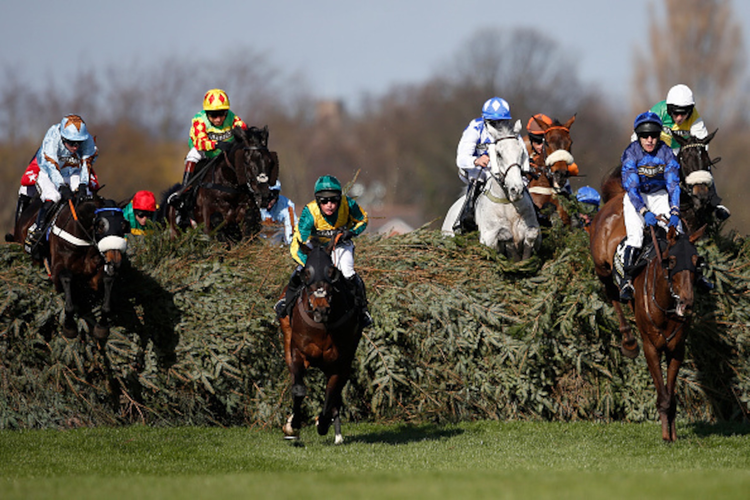 LIVERPOOL, ENGLAND - APRIL 11:   Leighton Aspell riding Many Clouds (R) clear 'The Chair' before winning The Crabbie's Grand National Steeple Chase on Crabbie's Grand National day at Aintree racecourse on April 11, 2015 in Liverpool, England. (Photo by Al