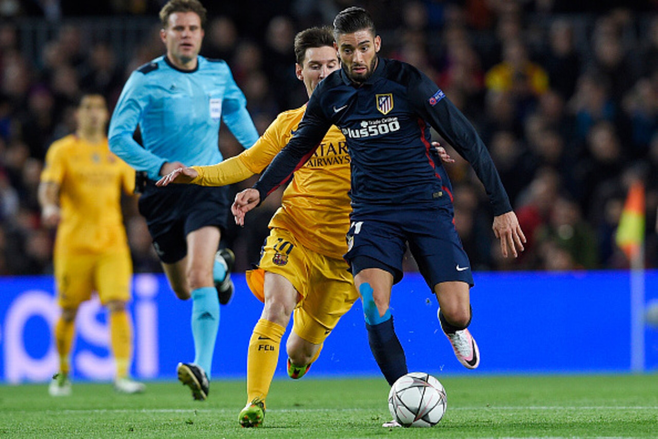 Barcelona's Argentinian forward Lionel Messi (2ndR) vies with Atletico Madrid's Belgian midfielder Yannick Ferreira Carrasco during the UEFA Champions League quarter finals first leg football match FC Barcelona vs Atletico de Madrid at the Camp Nou stadiu