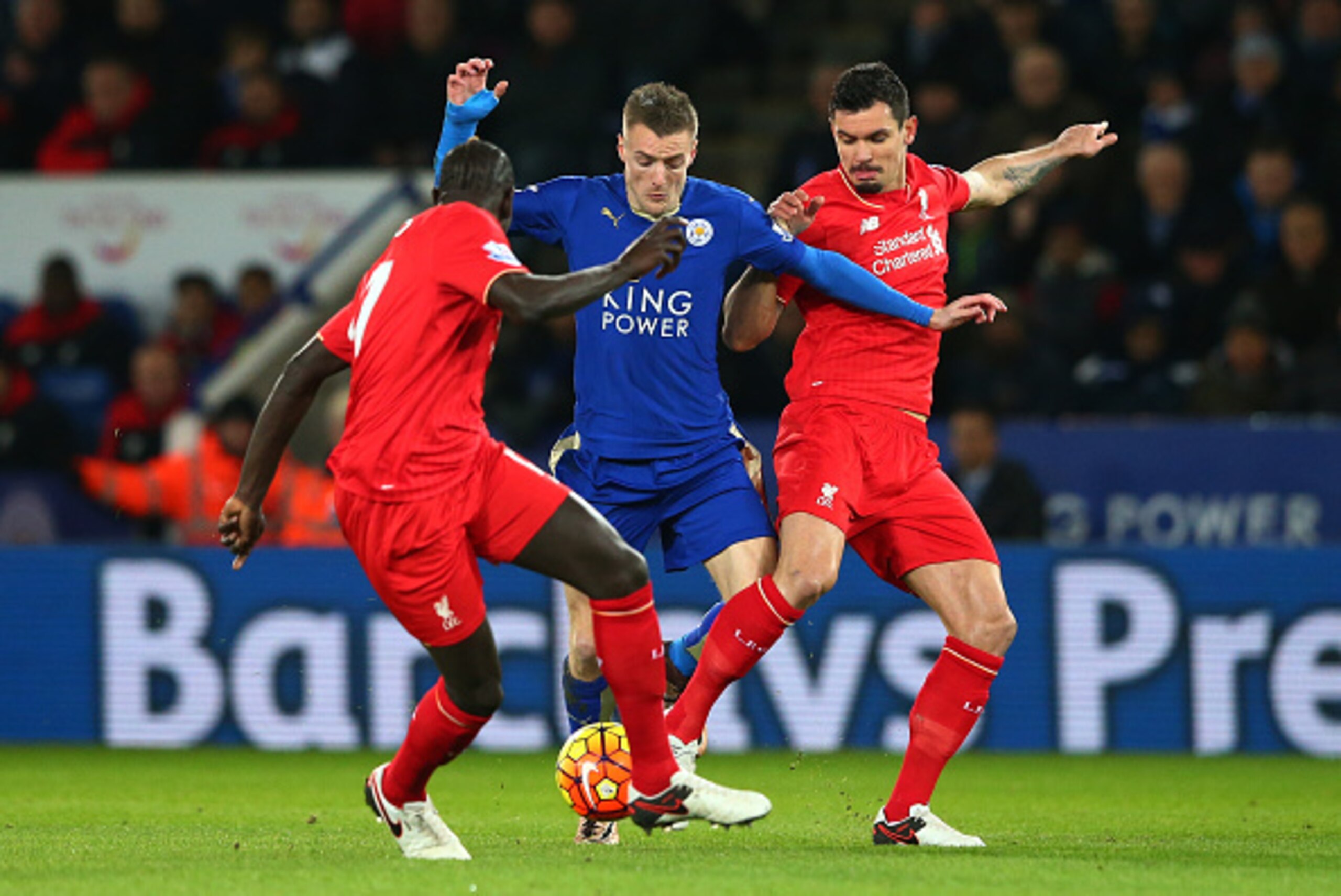 LEICESTER, ENGLAND - FEBRUARY 02: Jamie Vardy (C) of Leicester City controls the ball against Dejan Lovren (R) and Mamadou Sakho (L) of Liverpool during the Barclays Premier League match between Leicester City and Liverpool at The King Power Stadium on Fe LEICESTER, ENGLAND - FEBRUARY 02: Jamie Vardy (C) of Leicester City controls the ball against Dejan Lovren (R) and Mamadou Sakho (L) of Liverpool during the Barclays Premier League match between Leicester City and Liverpool at The King Power Stadium on Fe