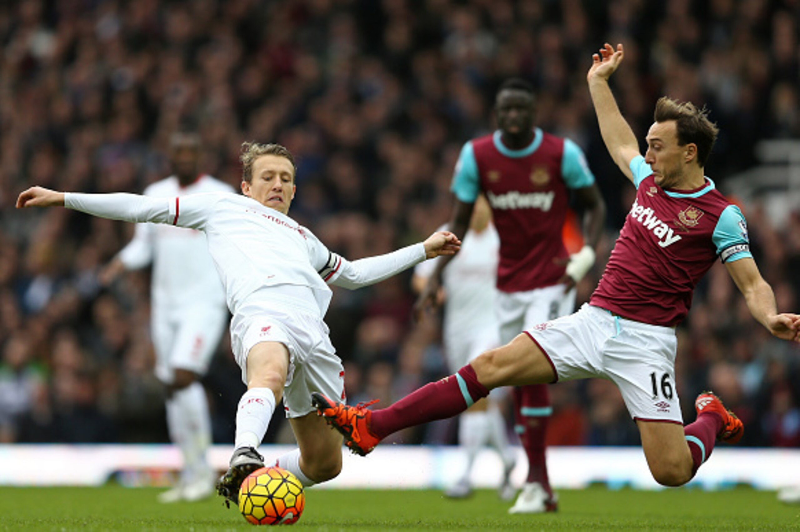 West Ham United's English midfielder Mark Noble (R) vies with Liverpool's Brazilian midfielder Lucas Leiva during the English Premier League football match between West Ham United and Liverpool at The Boleyn Ground in Upton Park, East London on January 2,