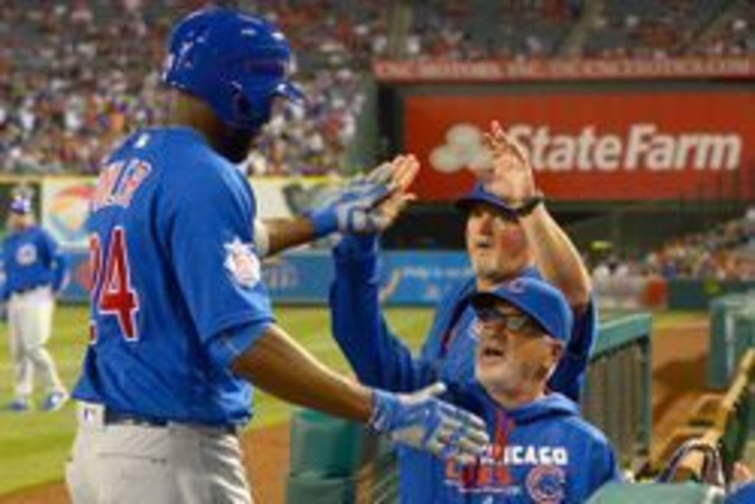 Apr 5, 2016; Anaheim, CA, USA; Chicago Cubs center fielder Dexter Fowler (24) is greeted at the dugout by Chicago Cubs manager Joe Maddon (70) after hitting a two-run home run in the seventh inning against the Los Angeles Angels at Angel Stadium of Anahei Apr 5, 2016; Anaheim, CA, USA; Chicago Cubs center fielder Dexter Fowler (24) is greeted at the dugout by Chicago Cubs manager Joe Maddon (70) after hitting a two-run home run in the seventh inning against the Los Angeles Angels at Angel Stadium of Anahei