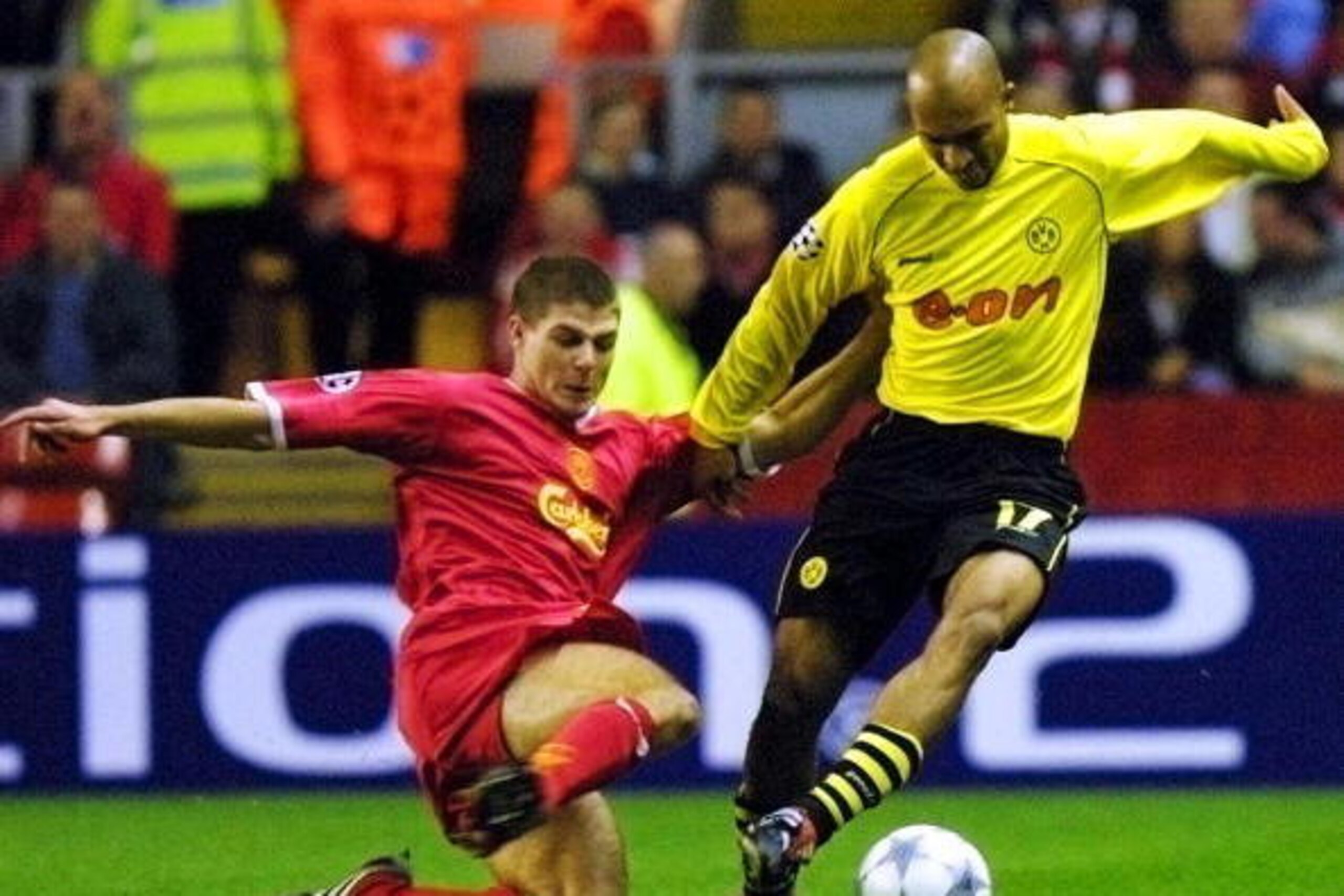 LIVERPOOL, UNITED KINGDOM:  Liverpool's Steven Gerrard (L) tackles Dede of Borussia Dortmund during their Champions League match at Anfield in Liverpool 30 October 2001. AFP PHOTO Adrian DENNIS (Photo credit should read ADRIAN DENNIS/AFP/Getty Images)