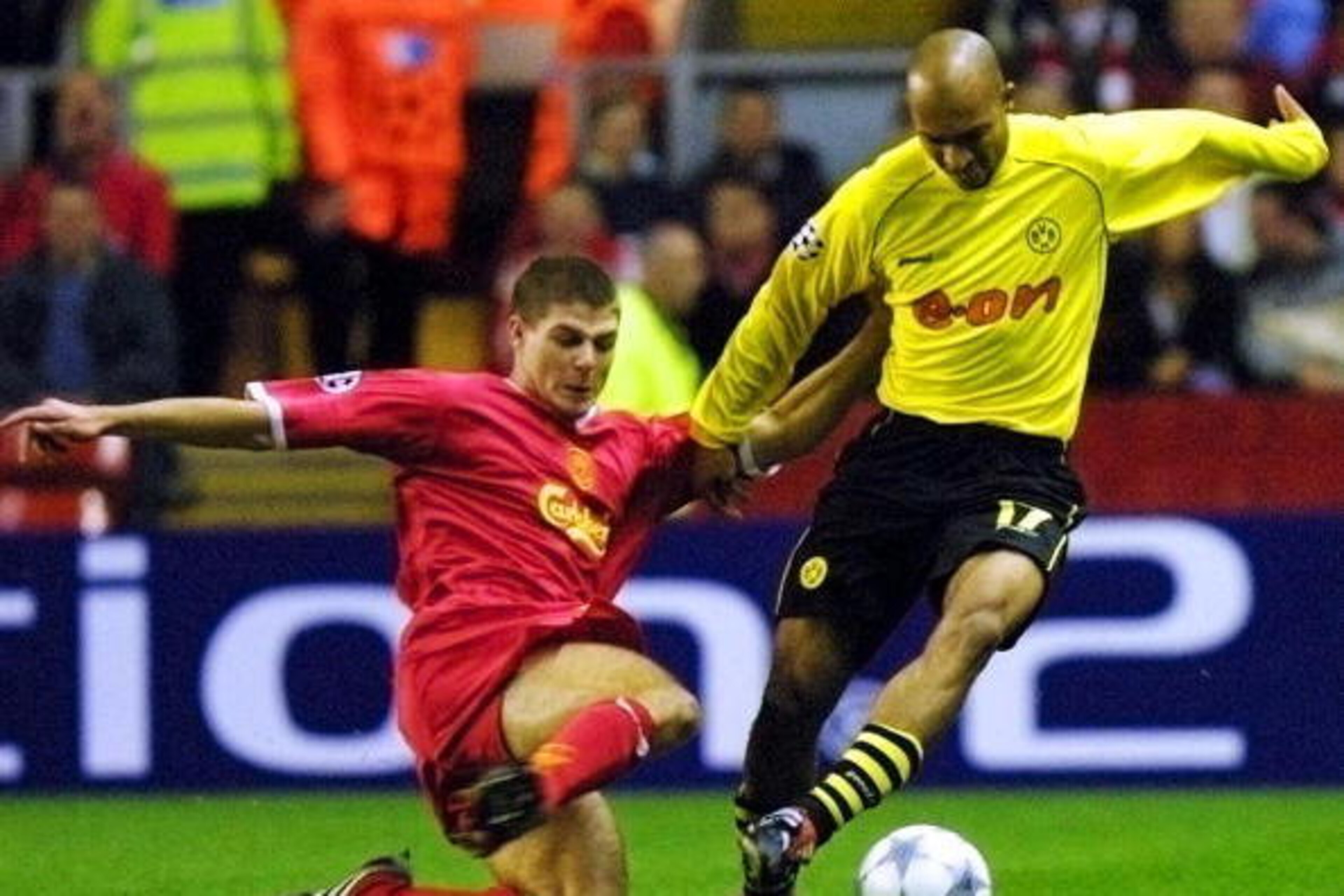 LIVERPOOL, UNITED KINGDOM:  Liverpool's Steven Gerrard (L) tackles Dede of Borussia Dortmund during their Champions League match at Anfield in Liverpool 30 October 2001. AFP PHOTO Adrian DENNIS (Photo credit should read ADRIAN DENNIS/AFP/Getty Images)