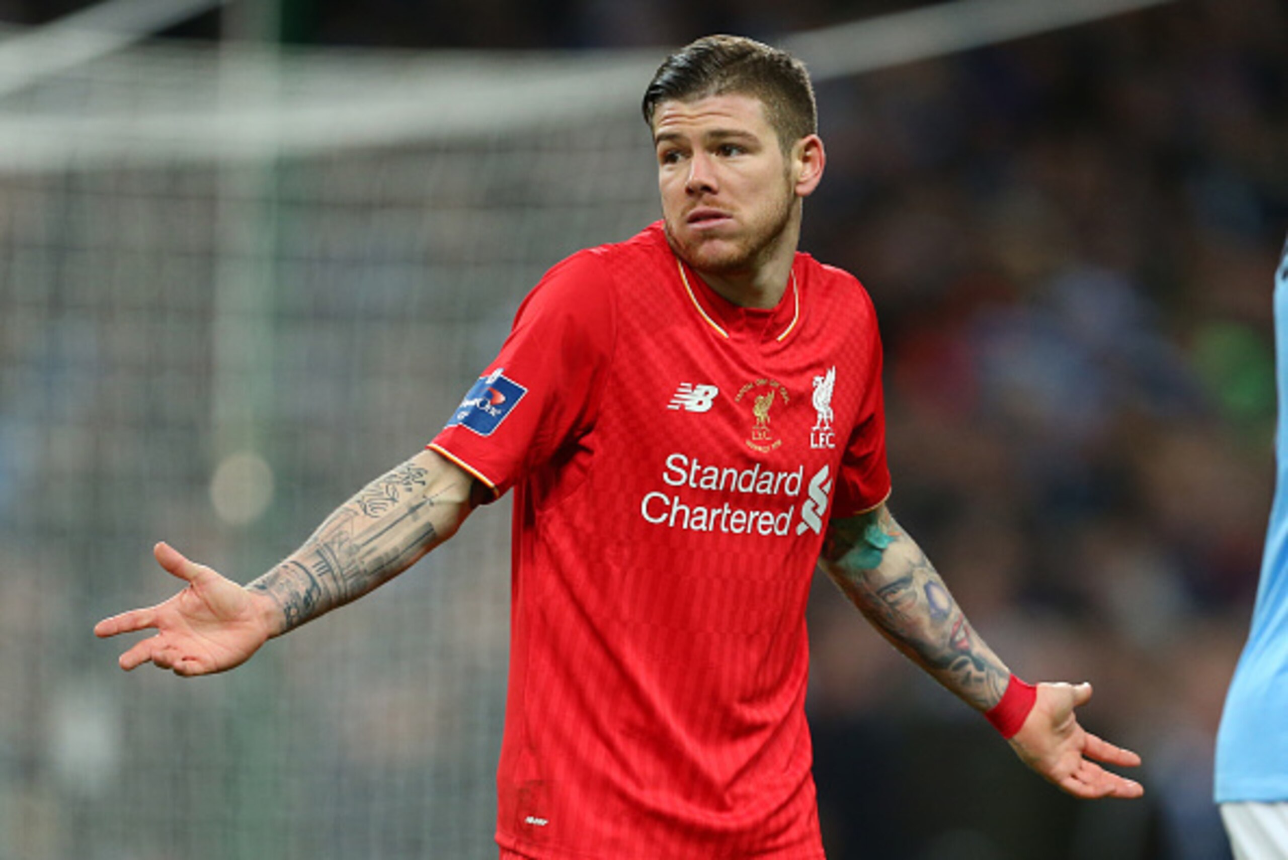 LONDON, ENGLAND - FEBRUARY 28 :  Alberto Moreno of Liverpool shrugs his shoulders during the Capital One Cup Final match between Liverpool and Manchester City at Wembley Stadium on February 28, 2016 in London, England.  (Photo by Catherine Ivill - AMA/Get
