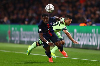 PARIS, FRANCE - APRIL 06: Serge Aurier of Paris Saint-Germain and Sergio Aguero of Manchester City compete for the ball during the UEFA Champions League Quarter Final First Leg match between Paris Saint-Germain and Manchester City at Parc des Princes on A