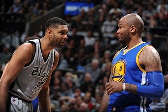 SAN ANTONIO, TX - MARCH 19:  Tim Duncan #21 of the San Antonio Spurs and Marreese Speights #5 of the Golden State Warriors during the game on March 19, 2016 at the AT&T Center in San Antonio, Texas. NOTE TO USER: User expressly acknowledges and agrees tha