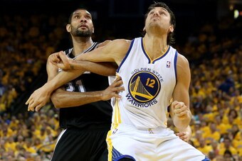 OAKLAND, CA - MAY 16:  Andrew Bogut #12 of the Golden State Warriors fights for position against Tim Duncan #21 of the San Antonio Spurs in Game Six of the Western Conference Semifinals during the 2013 NBA Playoffs on May 16, 2013 at the Oracle Arena in O