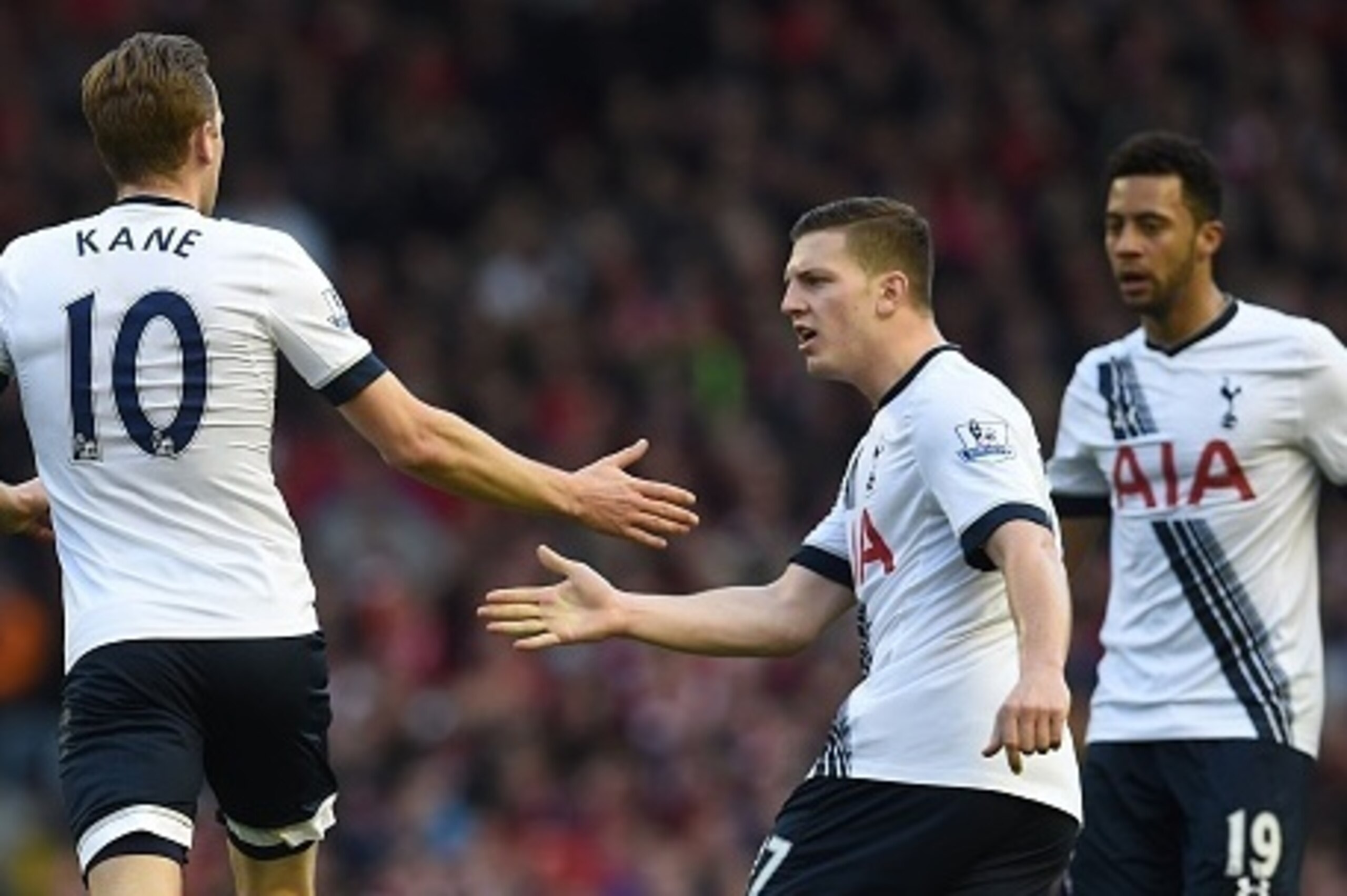 Tottenham Hotspur's English striker Harry Kane (L) celebrates with Tottenham Hotspur's Austrian defender Kevin Wimmer after scoring thier first goal during the English Premier League football match between Liverpool and Tottenham Hotspur at Anfield in Liv