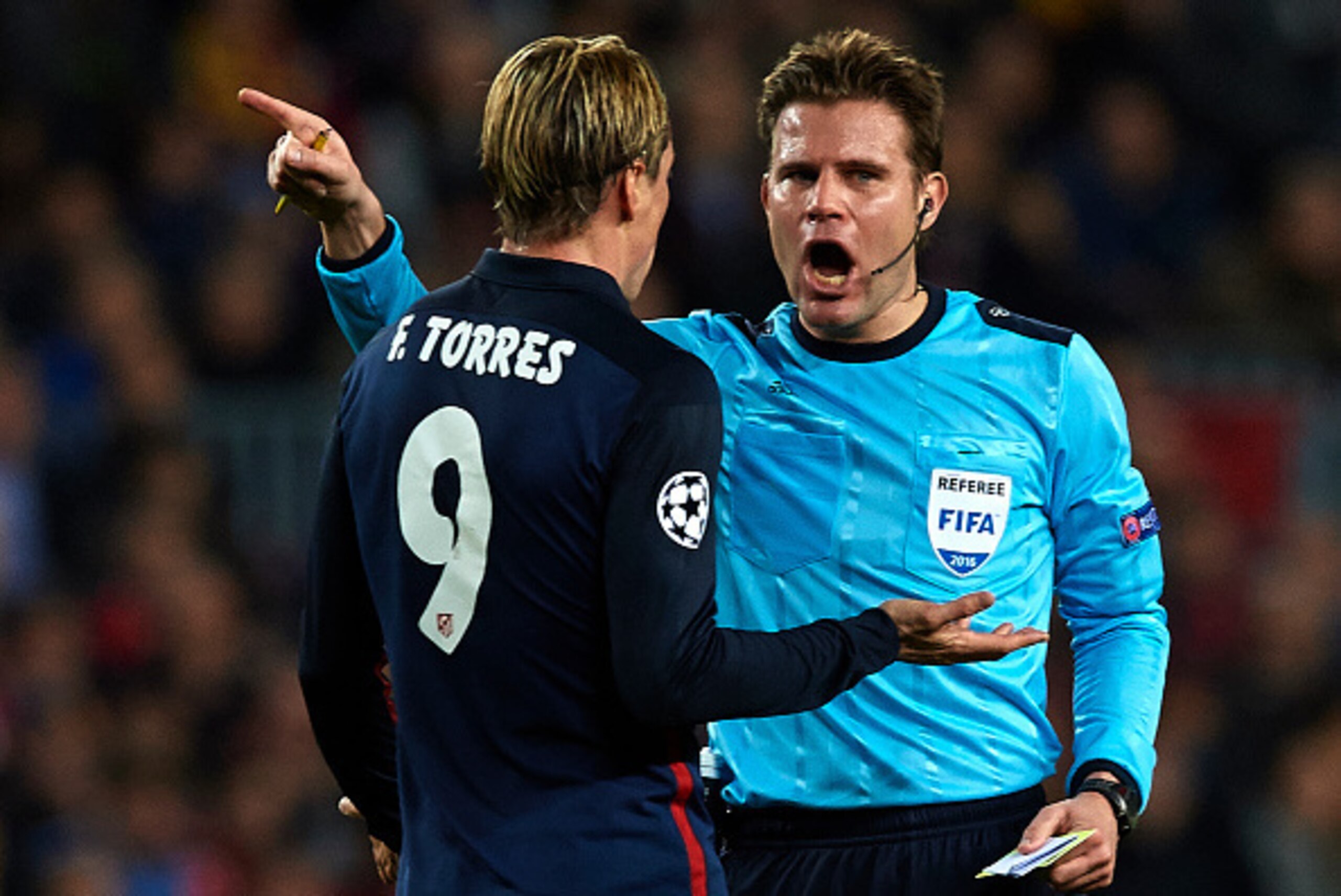 BARCELONA, SPAIN - APRIL 05:  Fernando Torres of Atletico Madrid is shown a yellow card by referee Felix Brych during the UEFA Champions League Quarter Final first leg match between FC Barcelona and Atletico de Madrid at Camp Nou on April 5, 2016 in Barce