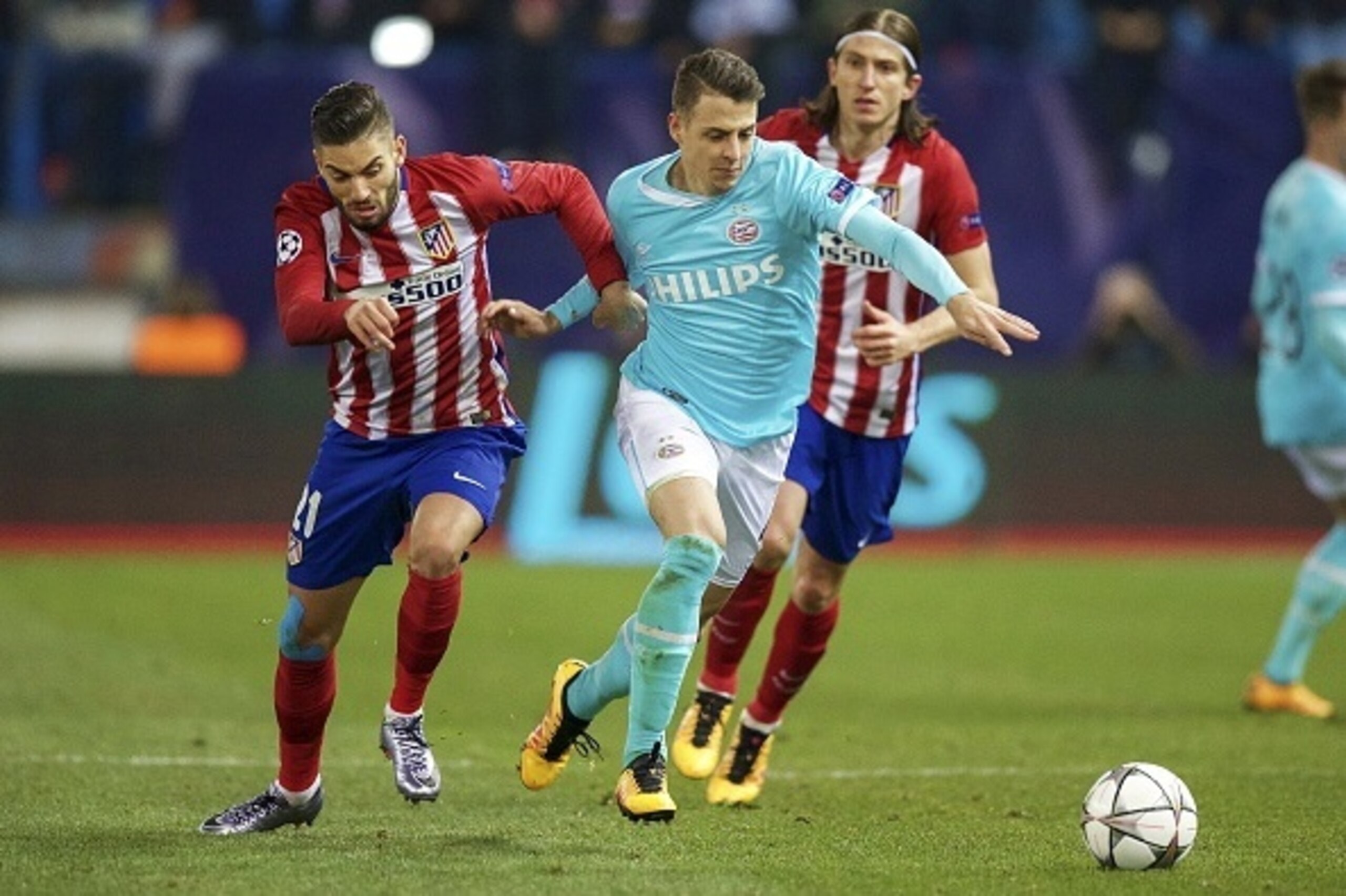(L-R) Yannick Carrasco of Club Atletico de Madrid, Santiago Arias of PSV, Filipe Luis of Club Atletico de Madrid during the UEFA Champions League Round of 16, Second leg match between Atletico madrid and PSV Eindhoven on March 15, 2016 at the Estadio Vice