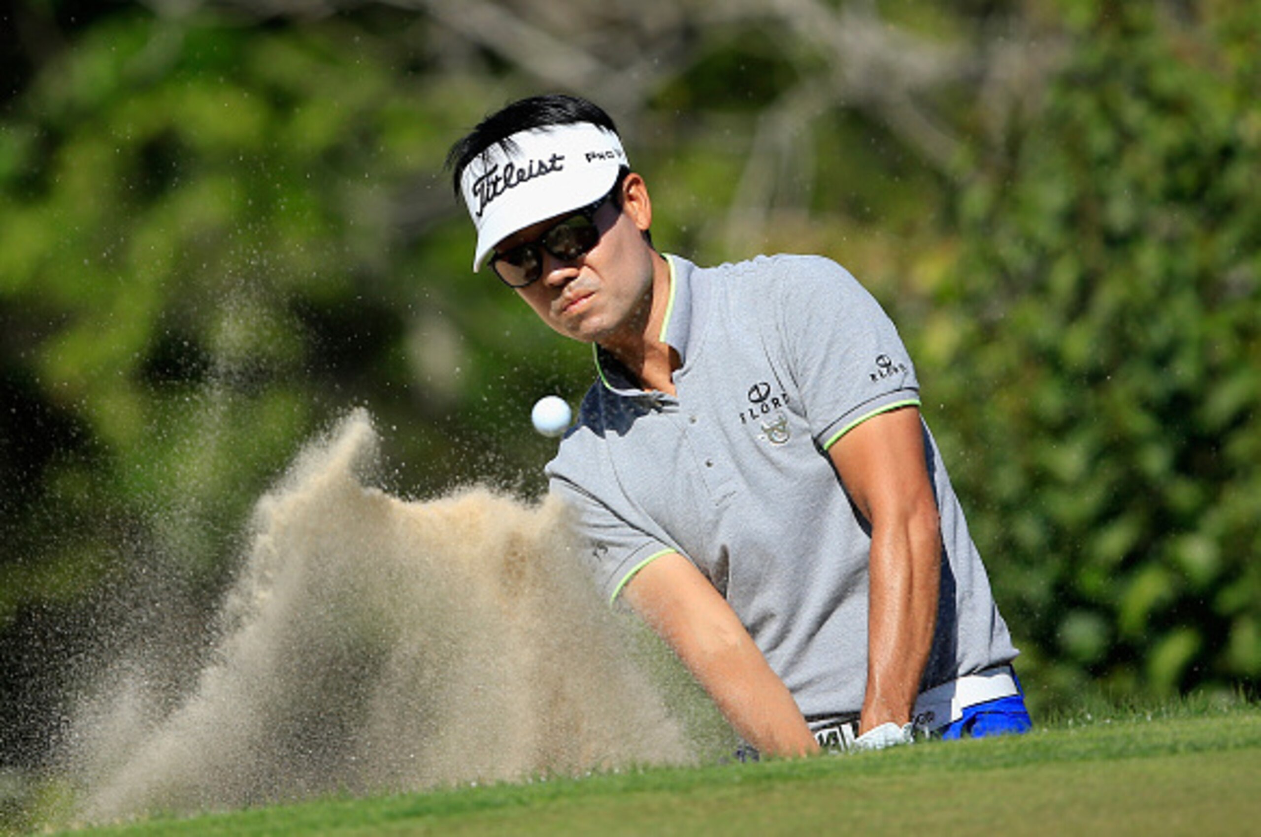 AUSTIN, TX - MARCH 25:  Kevin Na of the United States plays a bunker shot on the second playoff hole with Rory McIlroy during the third round of the World Golf Championships-Dell Match Play at the Austin Country Club on March 25, 2016 in Austin, Texas.  (