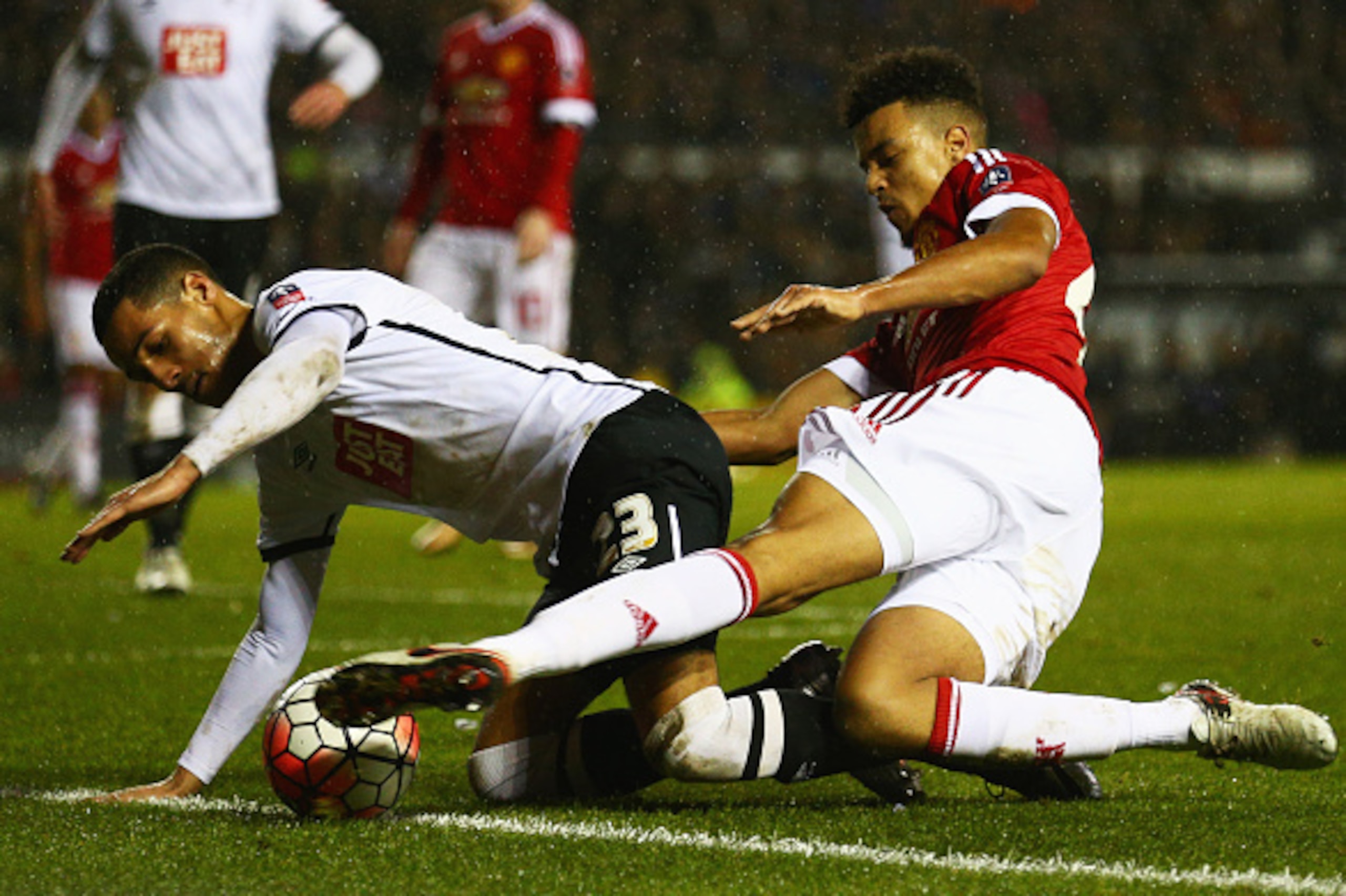 DERBY, ENGLAND - JANUARY 29:  Tom Ince of Derby County battles with Cameron Borthwick-Jackson of Manchester United during the Emirates FA Cup fourth round match between Derby County and Manchester United at iPro Stadium on January 29, 2016 in Derby, Engla