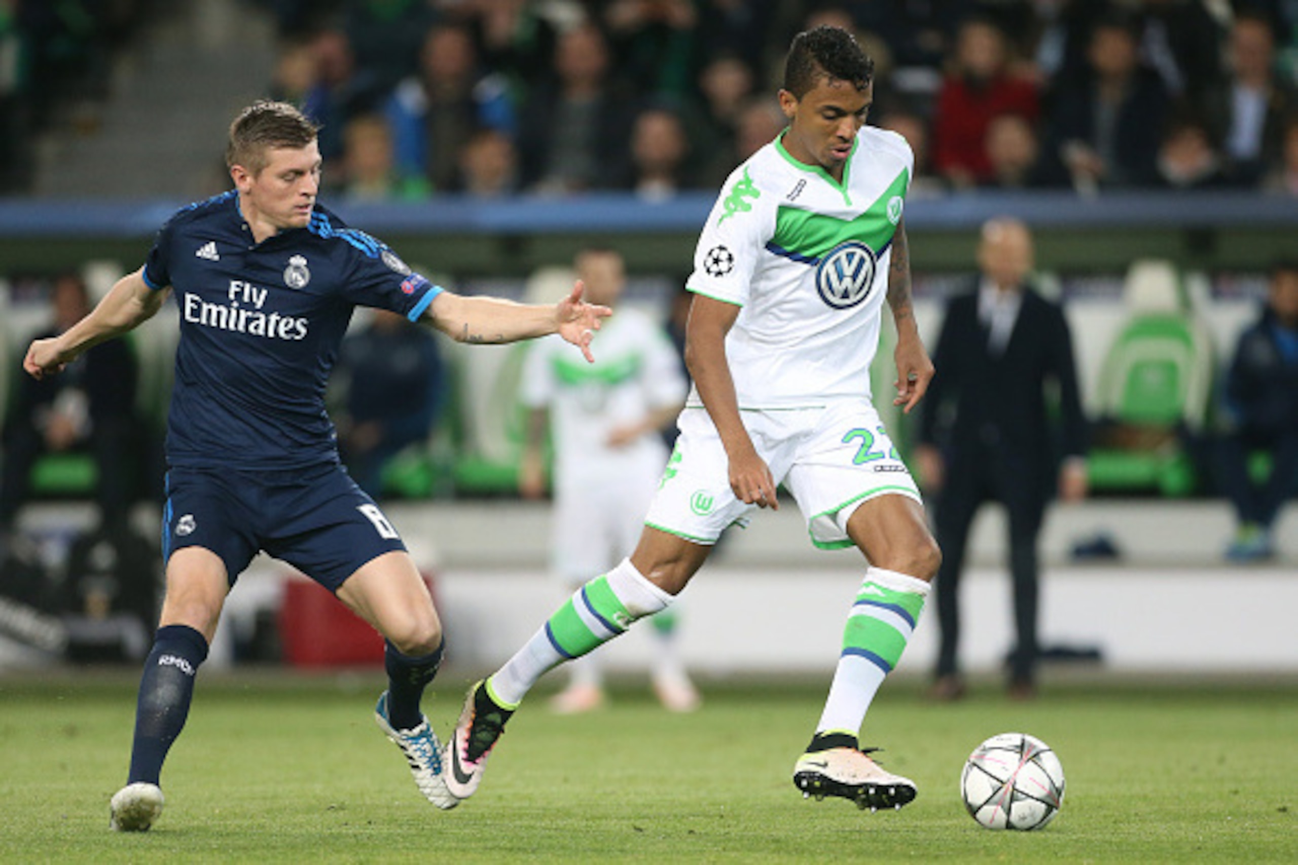 WOLFSBURG, GERMANY - APRIL 6: Toni Kroos of Real Madrid and Luiz Gustavo of Wolfsburg in action during the UEFA Champions League quarter final first leg match between VfL Wolfsburg and Real Madrid at Volkswagen Arena on April 6, 2016 in Wolfsburg, Germany