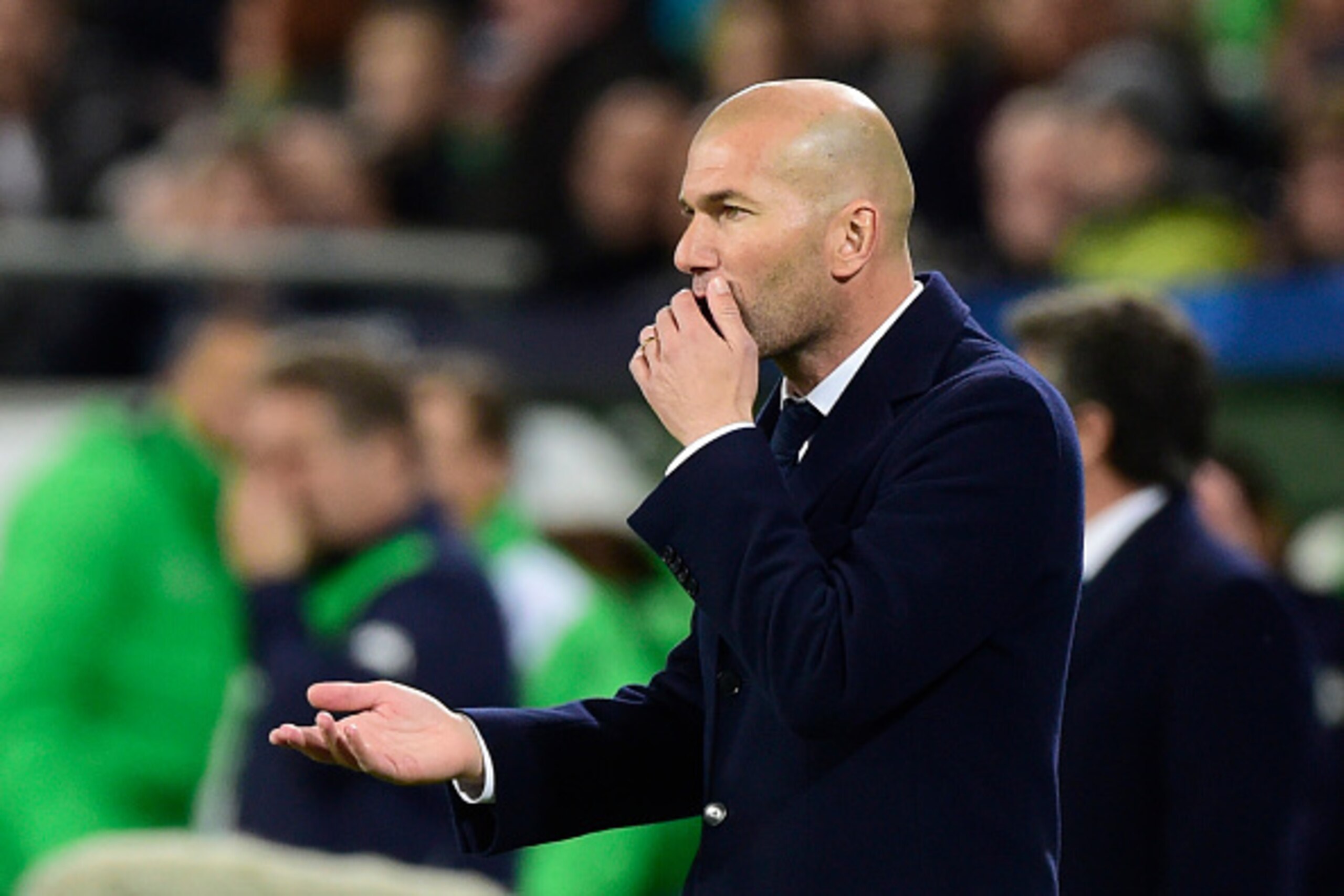 Real Madrid's French coach Zinedine Zidane reacts during the UEFA Champions League quarter-final, first-leg football match between VfL Wolfsburg and Real Madrid on April 6, 2016 in Wolfsburg, northern Germany. / AFP / John MACDOUGALL (Photo credit Real Madrid's French coach Zinedine Zidane reacts during the UEFA Champions League quarter-final, first-leg football match between VfL Wolfsburg and Real Madrid on April 6, 2016 in Wolfsburg, northern Germany. / AFP / John MACDOUGALL (Photo credit