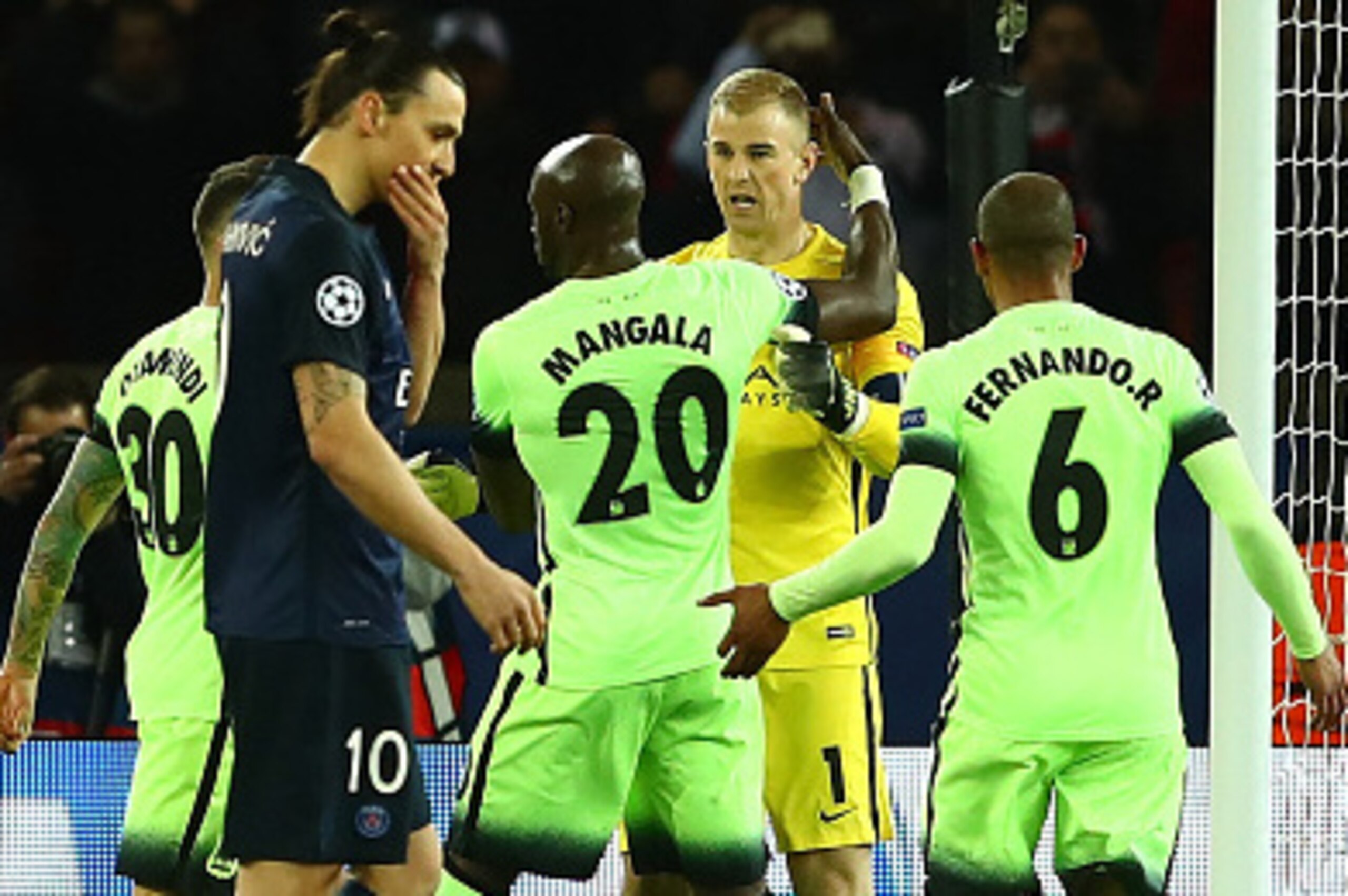 PARIS, FRANCE - APRIL 06:  Joe Hart (2nd R) of Manchester City is congratulated by his team mates on stopping a penalty by Zlatan Ibrahimovic (3rd L) of Paris Saint-Germain during the UEFA Champions League Quarter Final First Leg match between Paris Saint