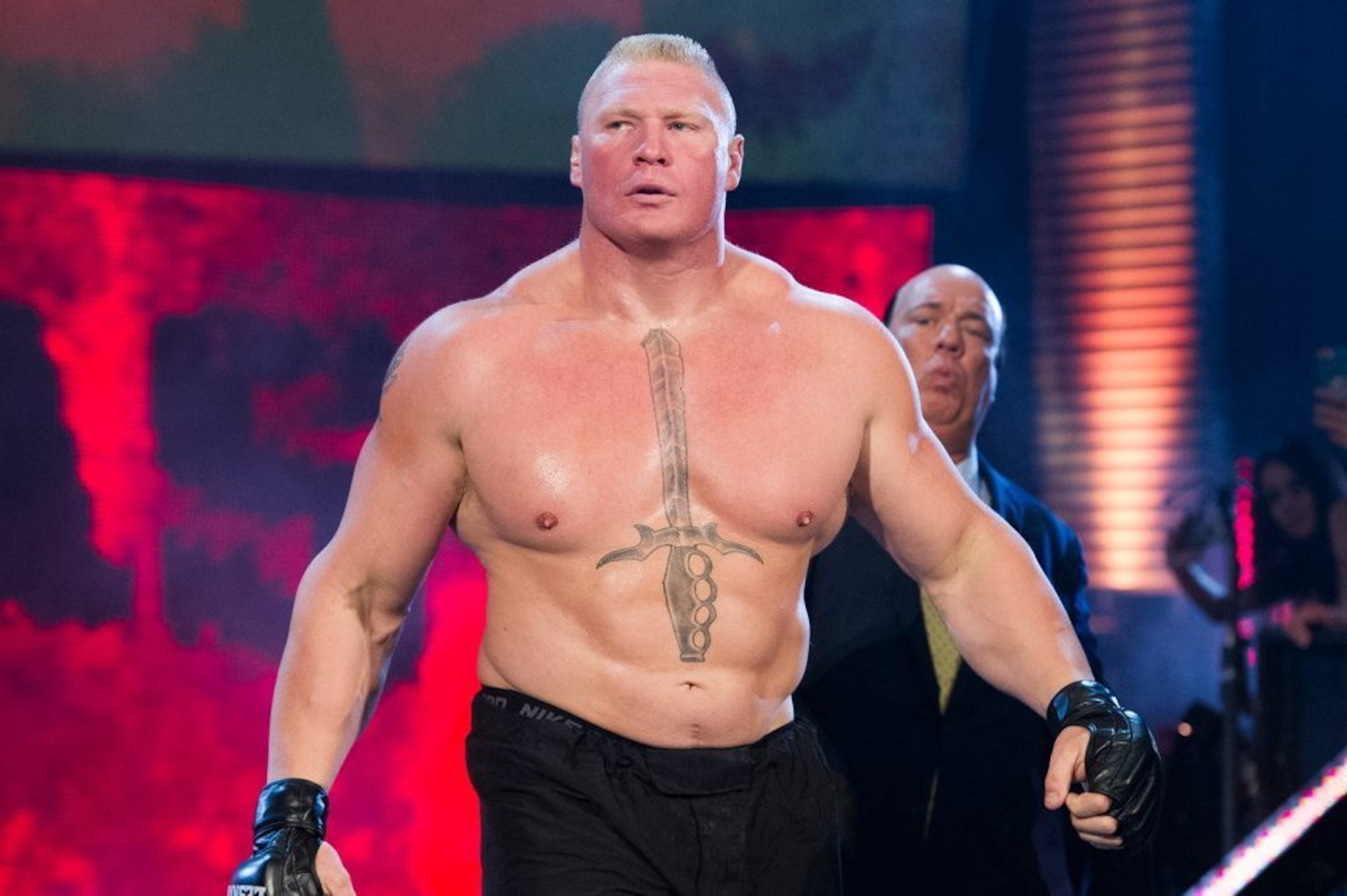 Paul Heyman accompanies Brock Lesnar.