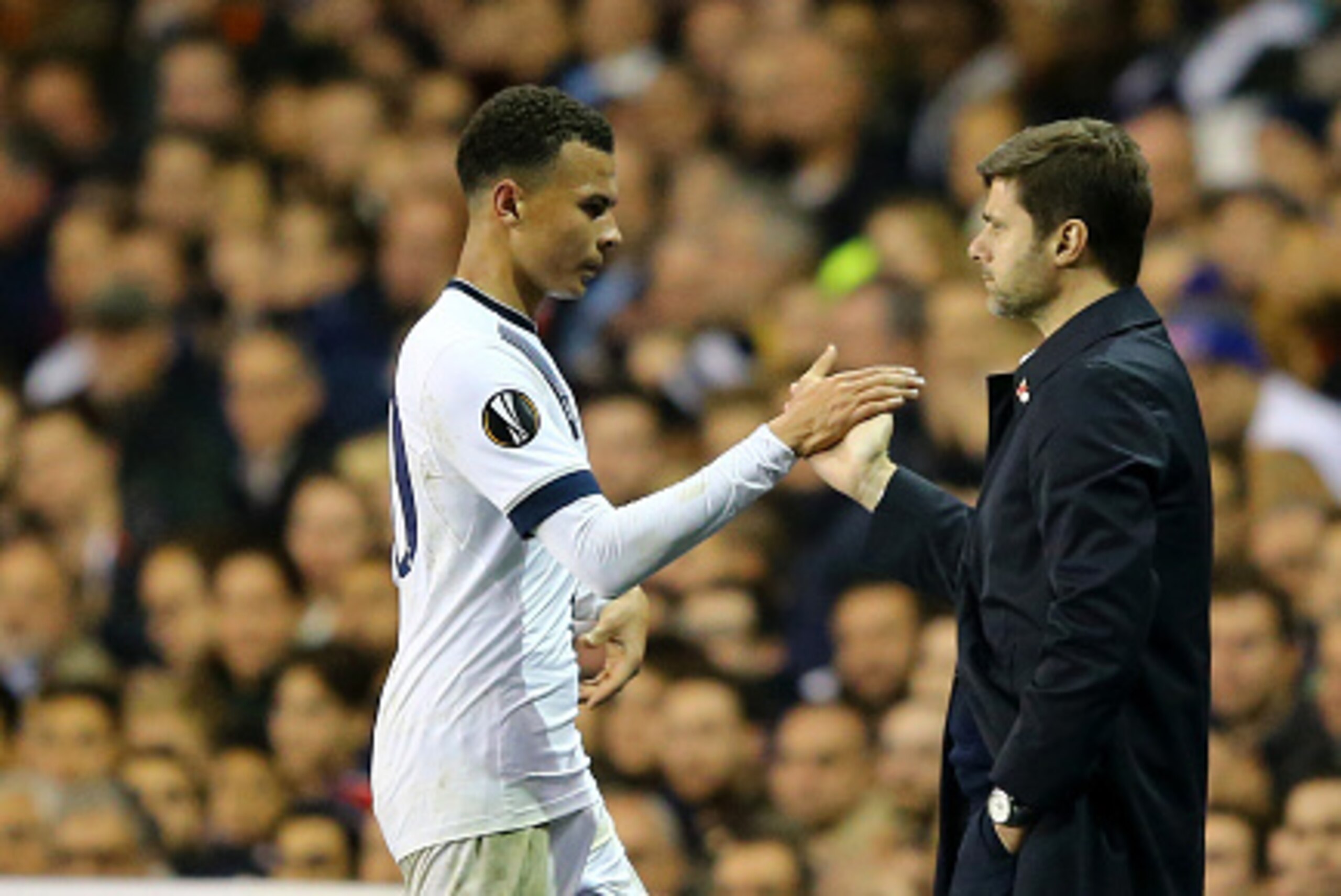 LONDON, ENGLAND - NOVEMBER 05:  Dele Alli of Spurs shakes hands with Mauricio Pochettino the manager of Spurs as he is substituted in the second half during the UEFA Europa League Group J match between Tottenham Hotspur FC and RSC Anderlecht at White Hart