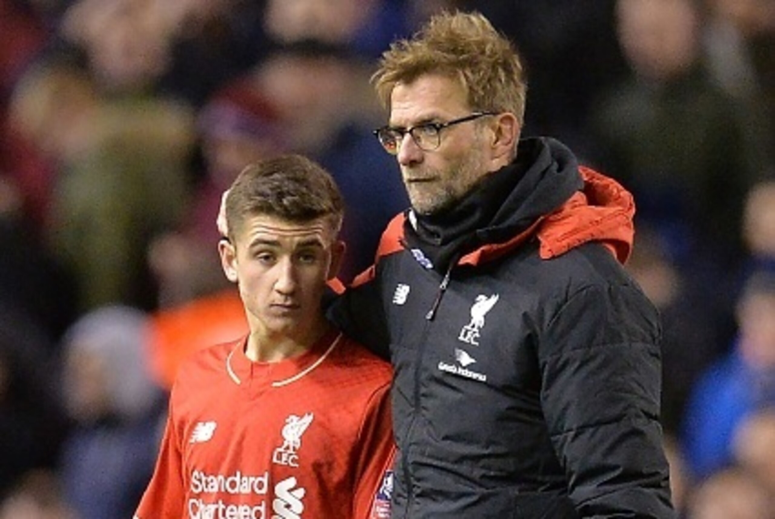 Liverpool's German manager Jurgen Klopp (R) speaks with Liverpool's English midfielder Cameron Brannagan after the end of the English FA Cup fourth round football match between Liverpool and West Ham United at Anfield in Liverpool, north west England, on 