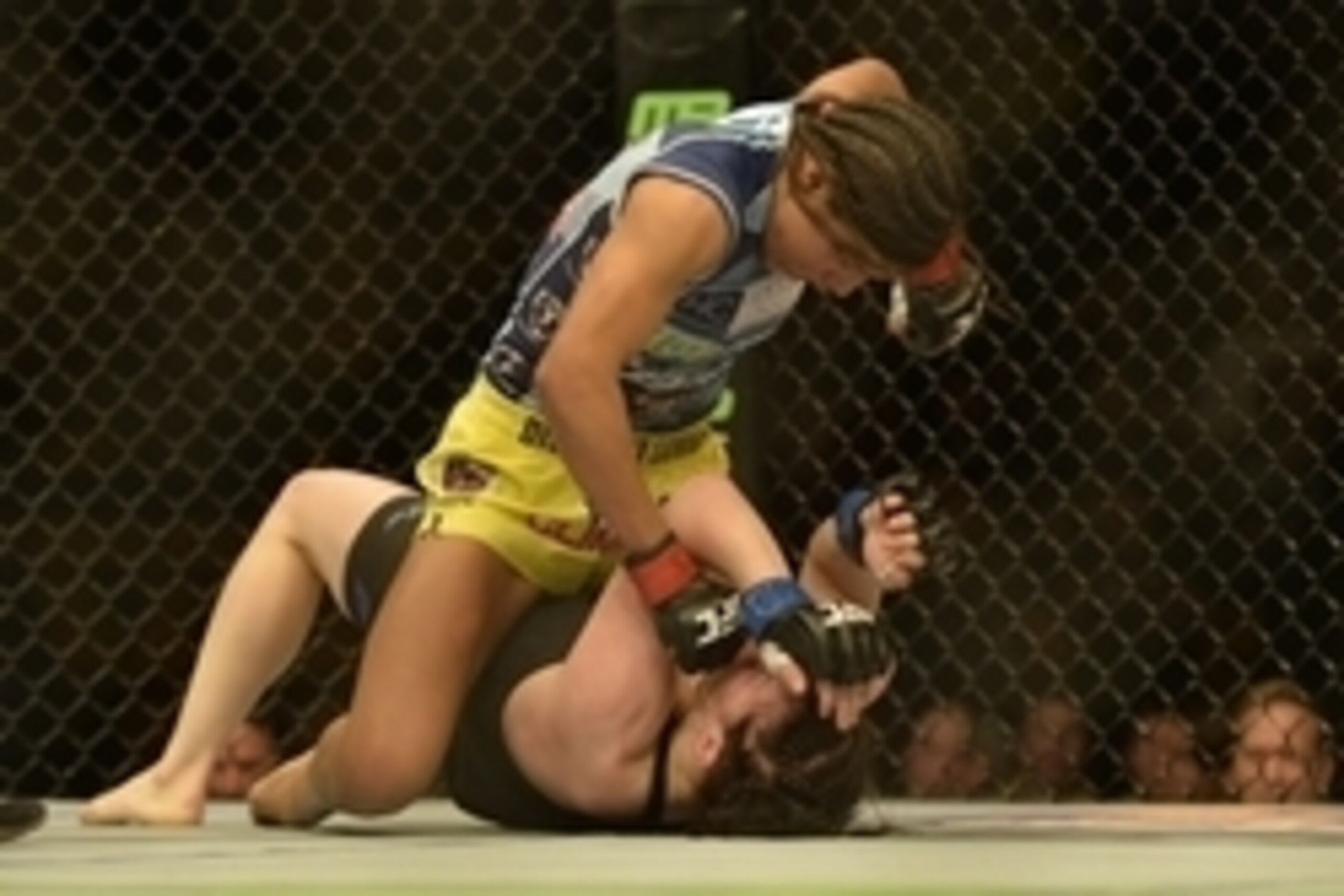 Apr 4, 2015; Fairfax, VA, USA; Julianna Pena (red gloves) fights Milana Dudieva (blue gloves) during UFC Fight Night at Patriot Center. Mandatory Credit: Tommy Gilligan-USA TODAY Sports