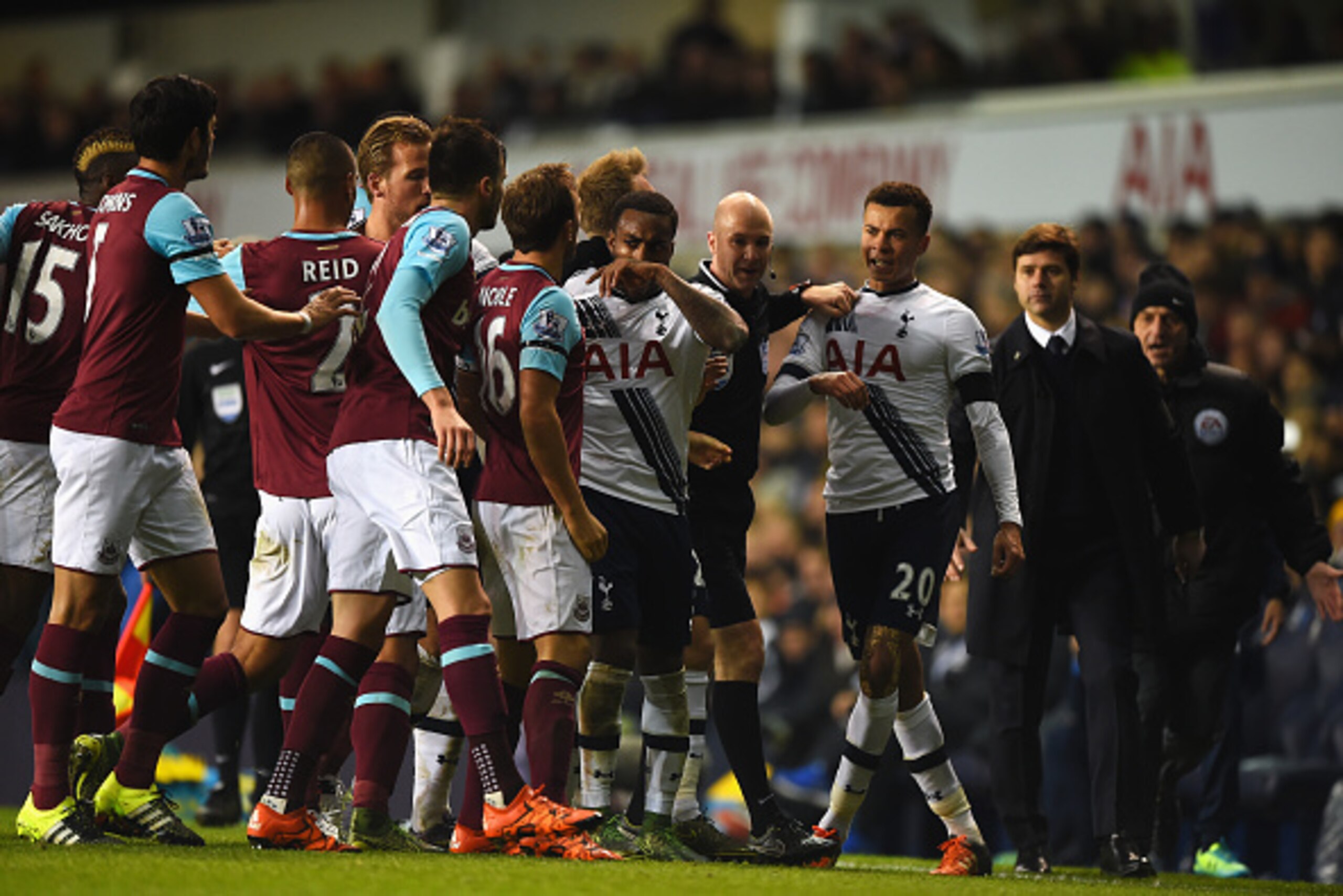LONDON, ENGLAND - NOVEMBER 22: Dele Alli of Tottenham Hotspur exchanges words with Mark Noble of West Ham United during the Barclays Premier League match between Tottenham Hotspur and West Ham United at White Hart Lane on November 22, 2015 in London, Engl
