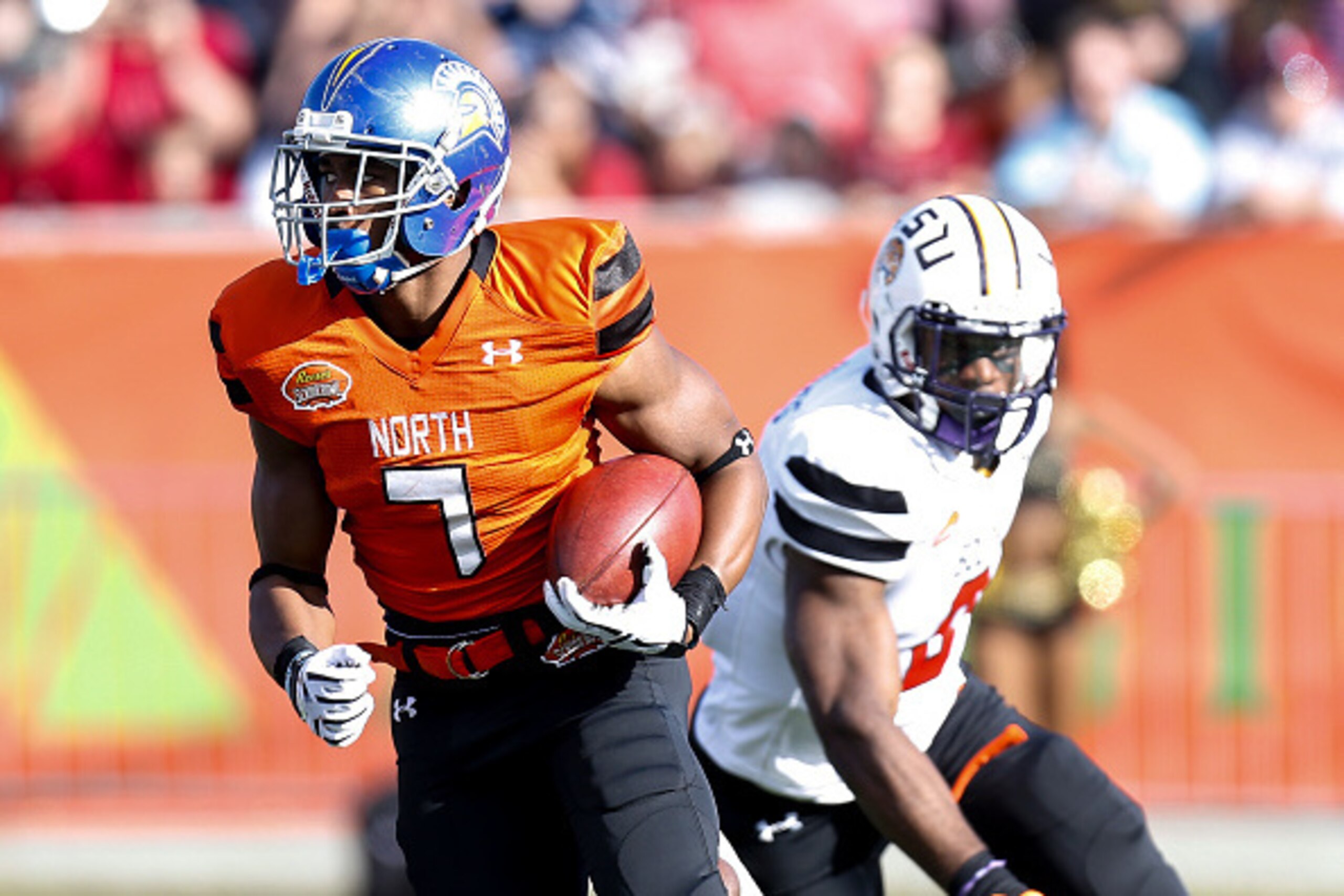MOBILE, AL - JANUARY 30: San Jose State Runningback Tyler Ervin #7 of the North Team avoids a tackle by LSU Defensive Back Jalen Mills #28 of the North Team during the 2016 Resse's Senior Bowl at Ladd-Peebles Stadium on January 30, 2016 in Mobile, Alabama