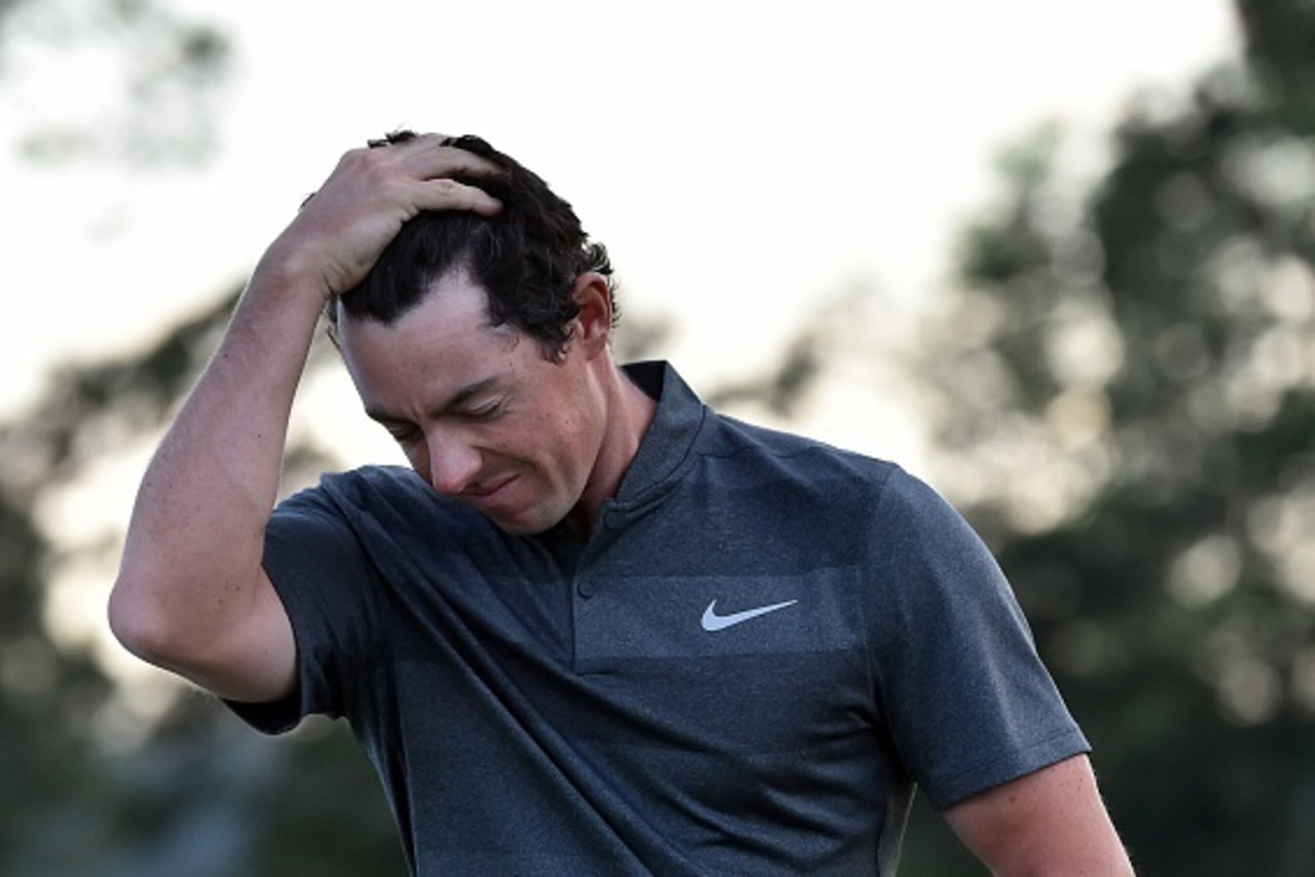 Northern Ireland's Rory McIlroy reacts as he leaves the 18th green during Round 1 of the 80th Masters Golf Tournament at the Augusta National Golf Club on April 7, 2016, in Augusta, Georgia.
 / AFP / Nicholas Kamm        (Photo credit should read NICHOLAS
