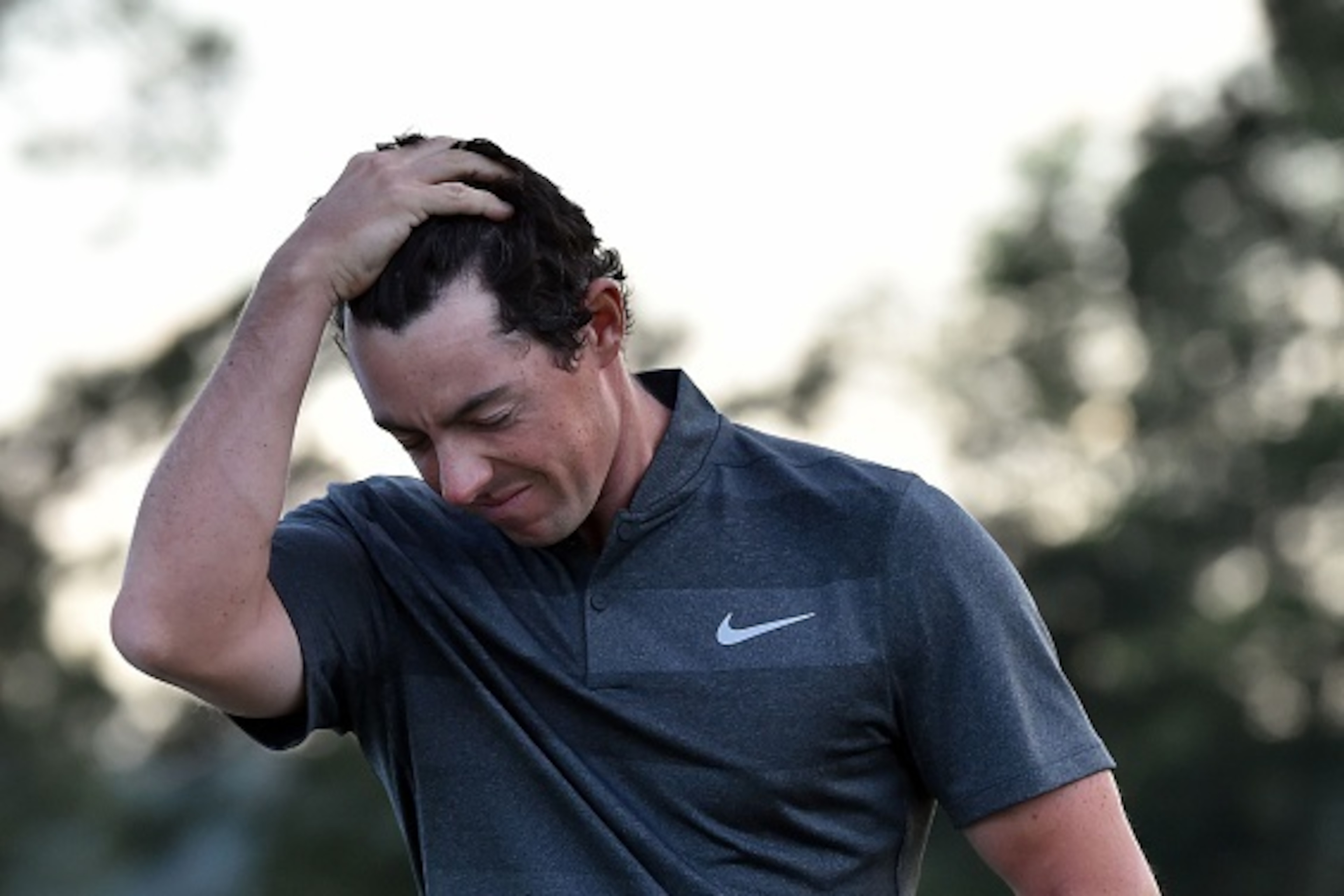 Northern Ireland's Rory McIlroy reacts as he leaves the 18th green during Round 1 of the 80th Masters Golf Tournament at the Augusta National Golf Club on April 7, 2016, in Augusta, Georgia.
 / AFP / Nicholas Kamm        (Photo credit should read NICHOLAS