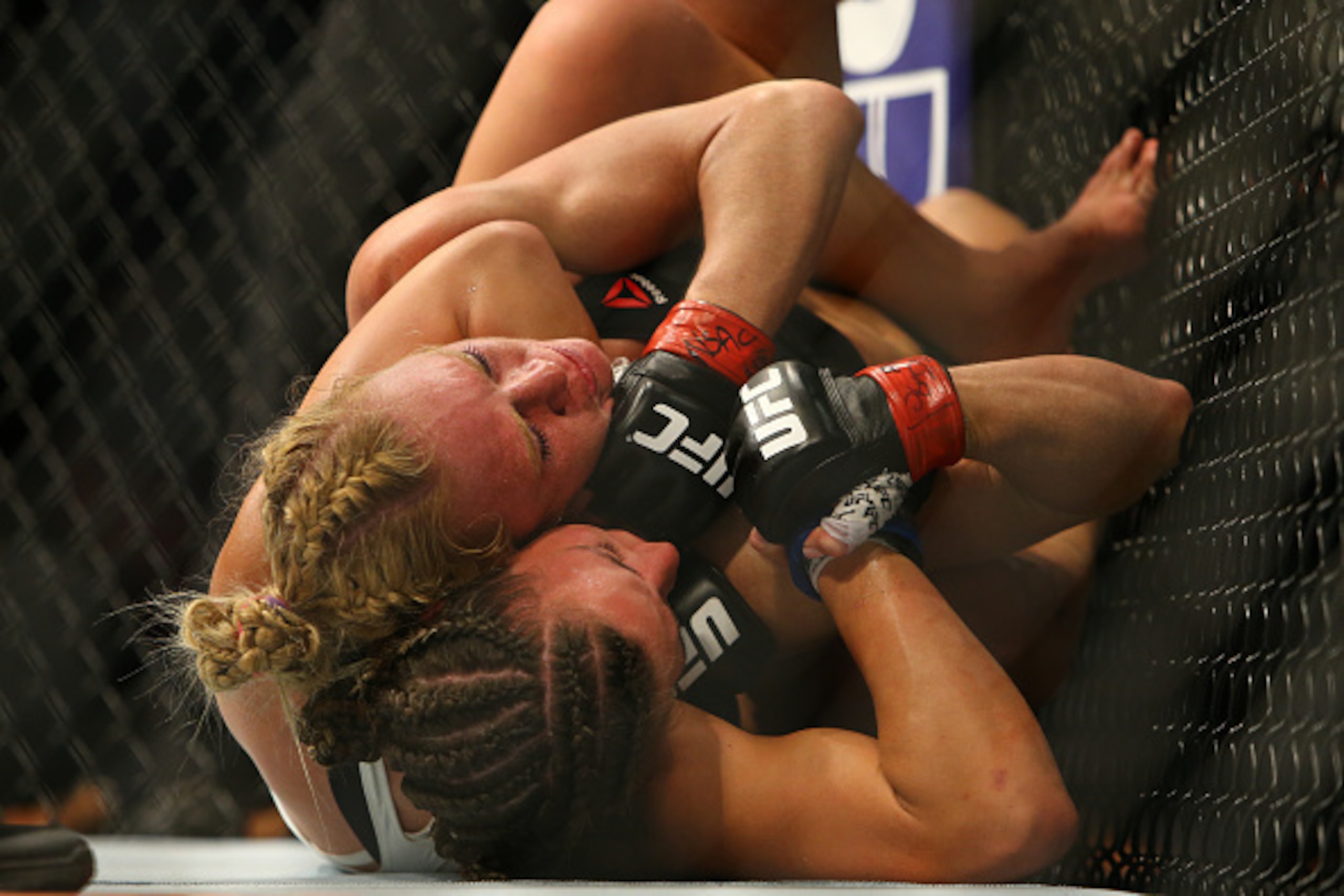 LAS VEGAS, NV - MARCH 5:  Miesha Tate attempts to submit UFC bantamweight champion Holly Holm during UFC 196 at the MGM Grand Garden Arena on March 5, 2016 in Las Vegas, Nevada. (Photo by Rey Del Rio/Getty Images)