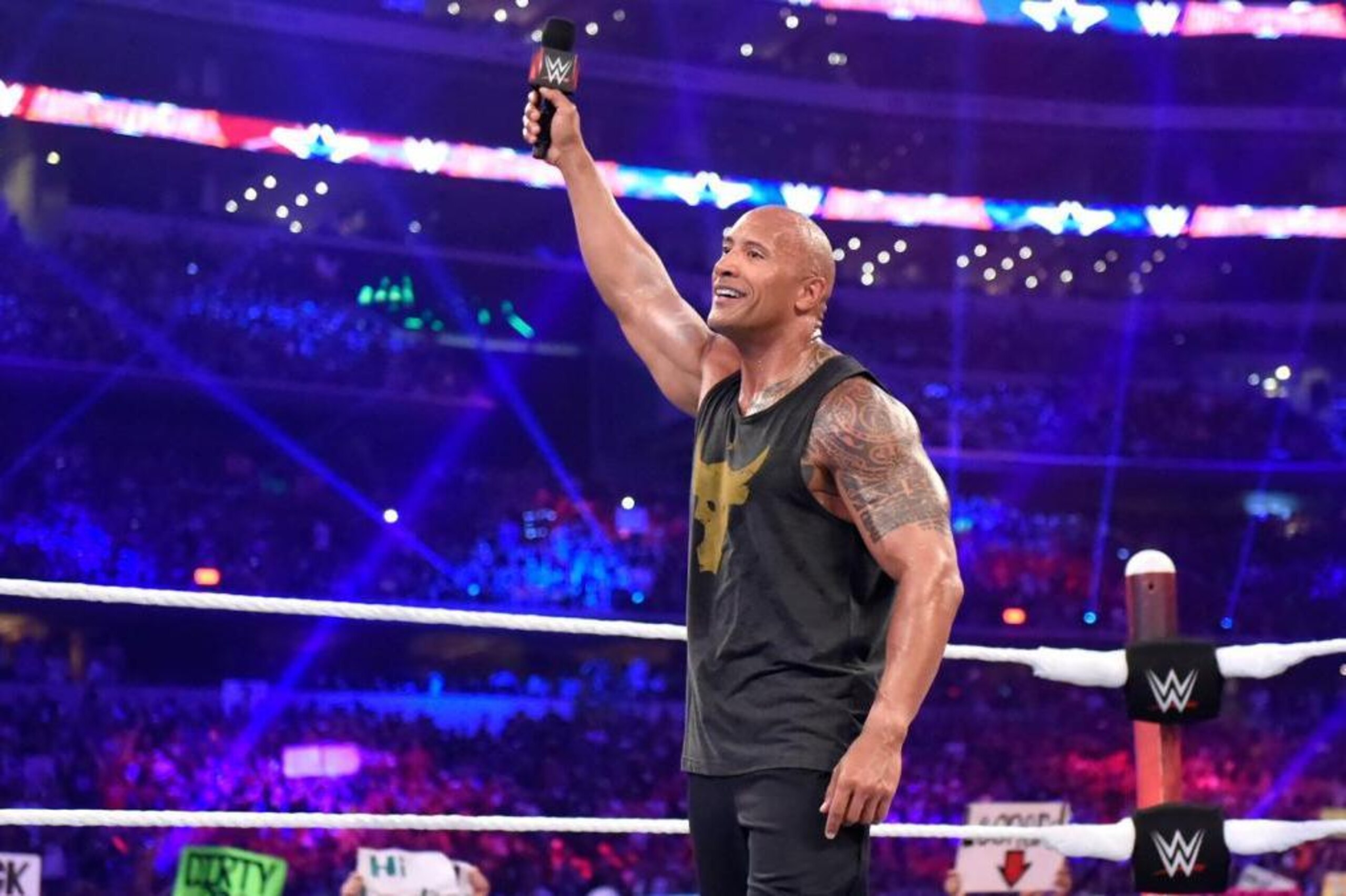 The Rock celebrates WWE's record-breaking crowd.