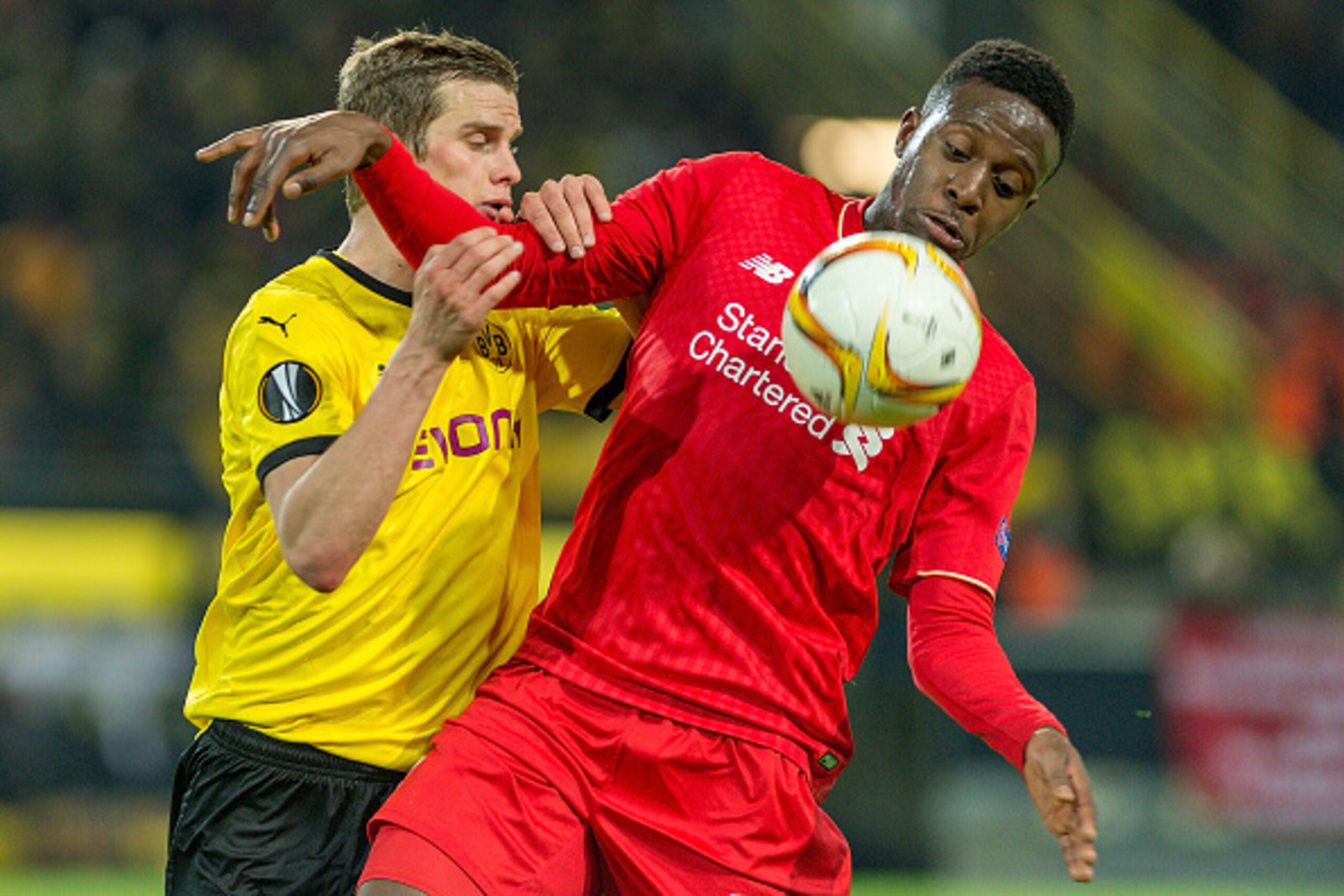 DORTMUND, GERMANY - APRIL 07: Forward Divock Origi (27) of FC Liverpool and Midfielder Sven Bender (6) of Borussia Dortmund fighting for the ball at Signal Iduna Park during the UEFA Europa League quarter final first leg match between Borussia Dortmund an