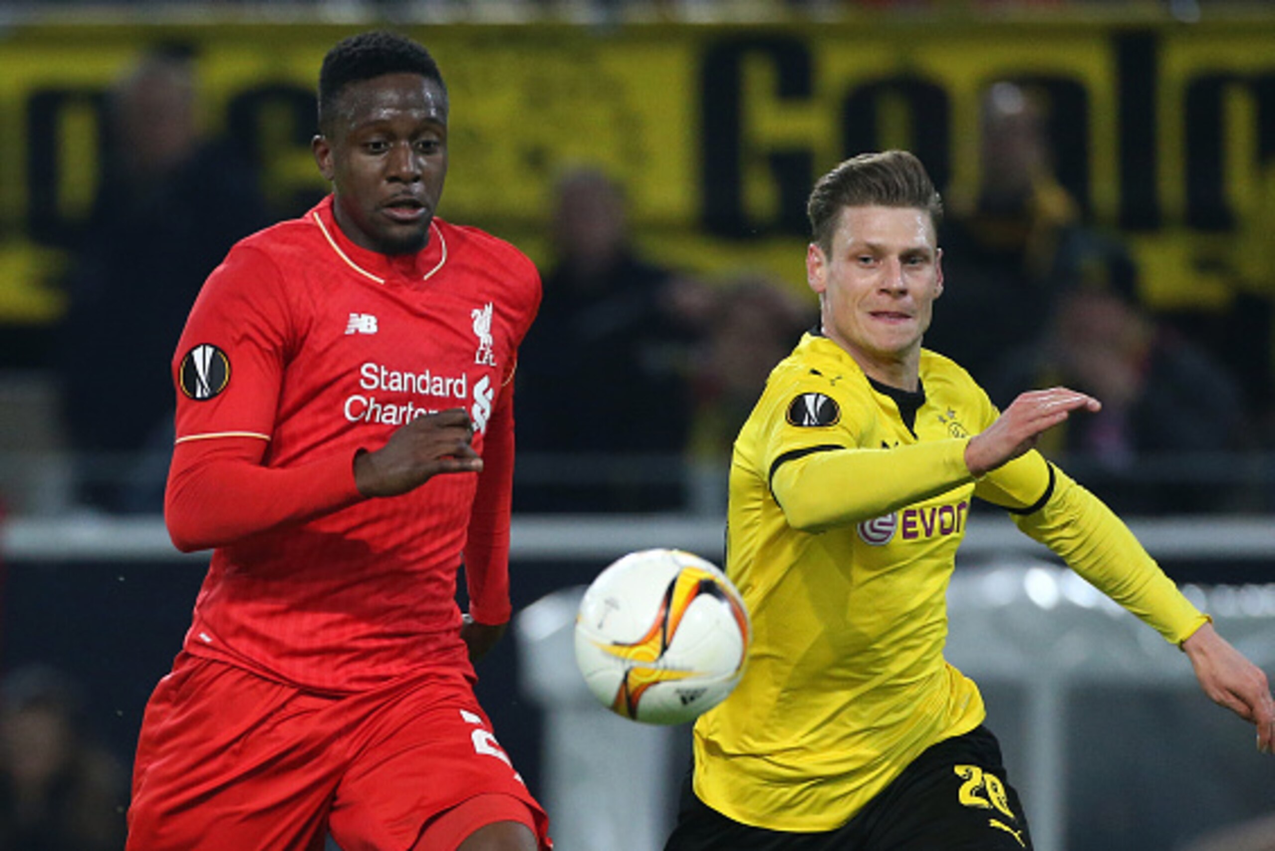 DORTMUND, GERMANY - APRIL 7: Divock Origi of Liverpool and Lukasz Piszczek of Dortmund in action during the UEFA Europa League quarter final first leg match between Borussia Dortmund and Liverpool FC at Signal Iduna Park aka Westfalenstadion on April 7, 2