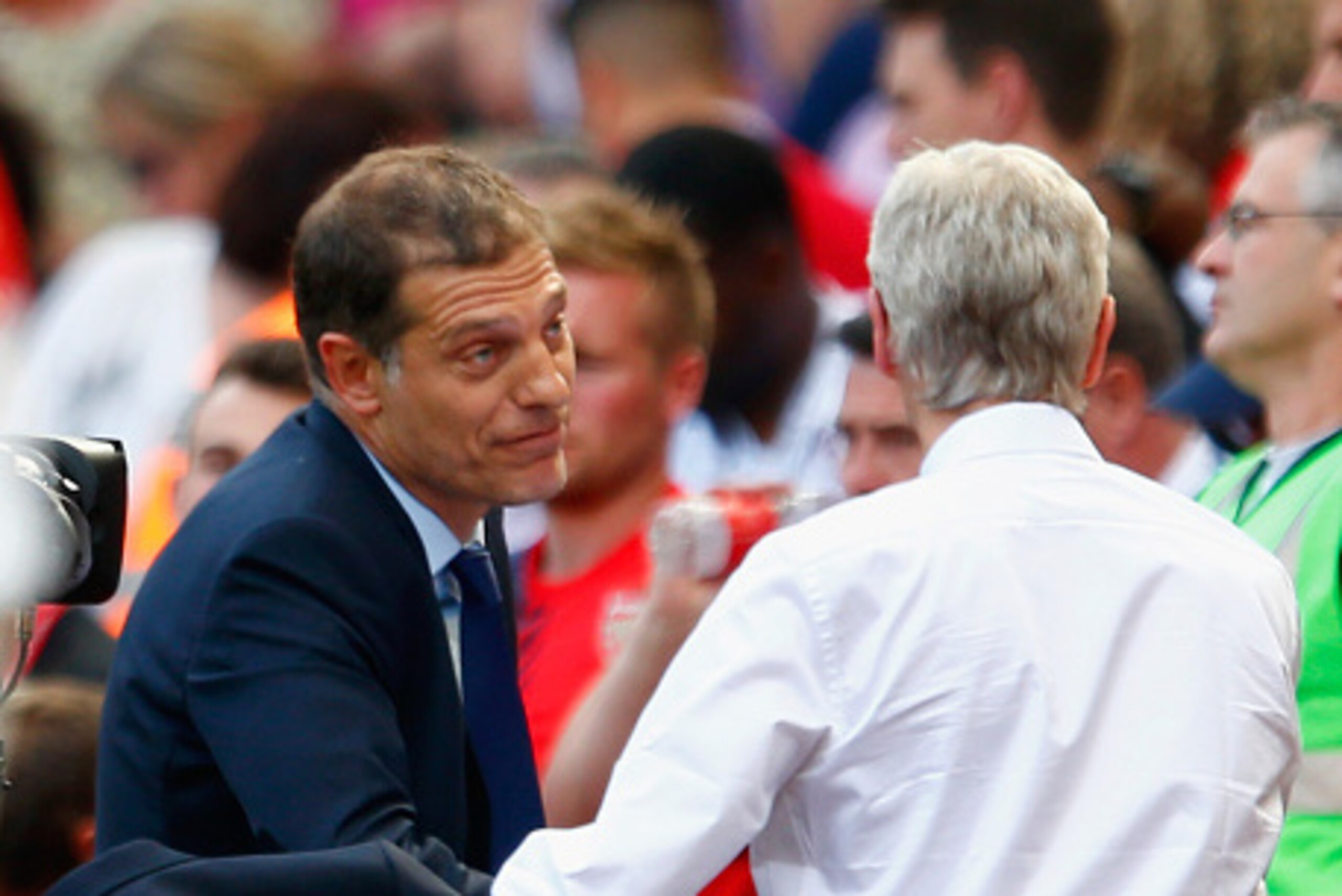 LONDON, ENGLAND - AUGUST 09:  Slaven Bilic manager of West Ham United shakes hands with Arsene Wenger manager of Arsenal after victory in the Barclays Premier League match between Arsenal and West Ham United at the Emirates Stadium on August 9, 2015 in Lo