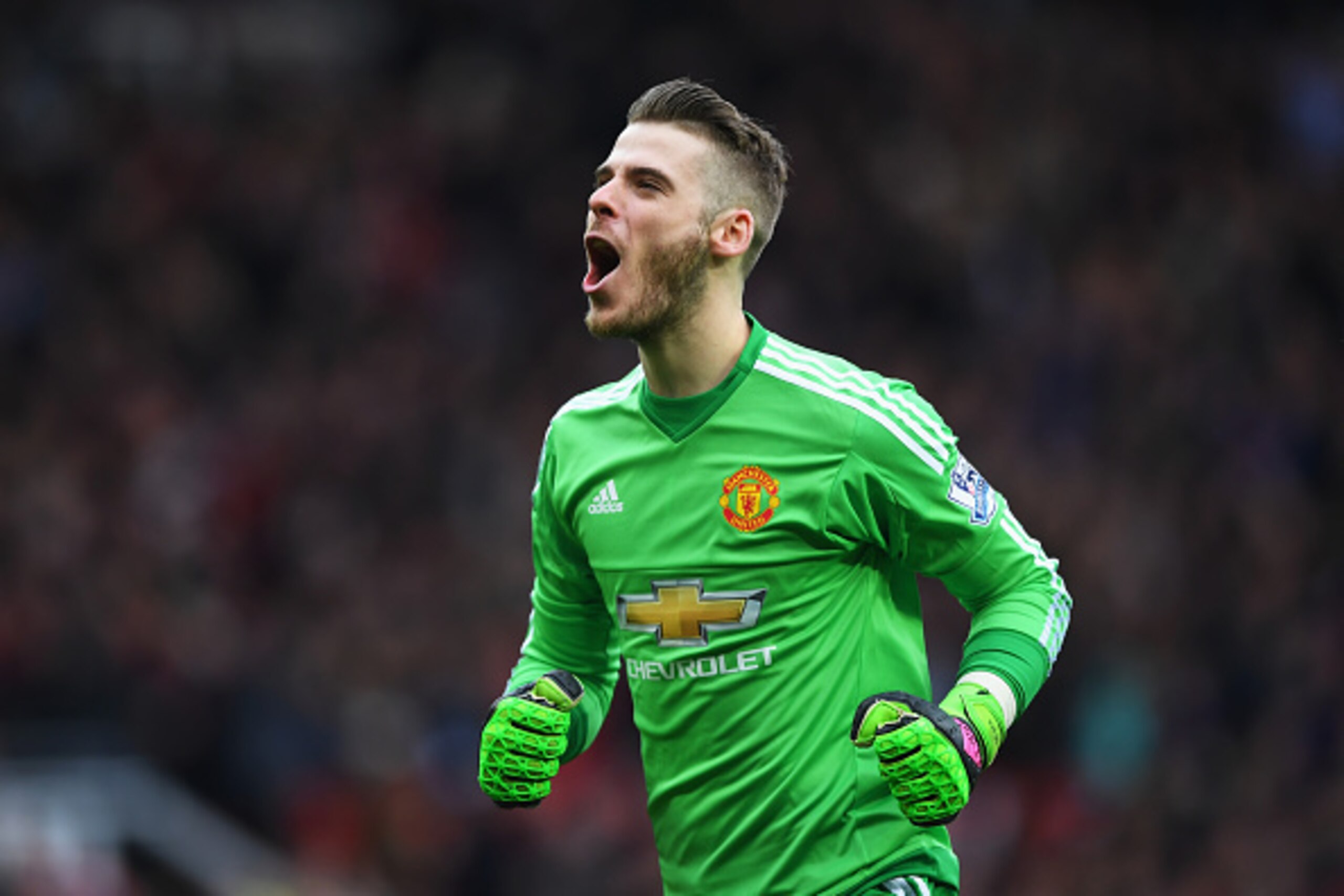 MANCHESTER, ENGLAND - APRIL 03:  David De Gea of Manchester United celebrates as Anthony Martial of Manchester United scores their first goal during the Barclays Premier League match between Manchester United and Everton at Old Trafford on April 3, 2016 i